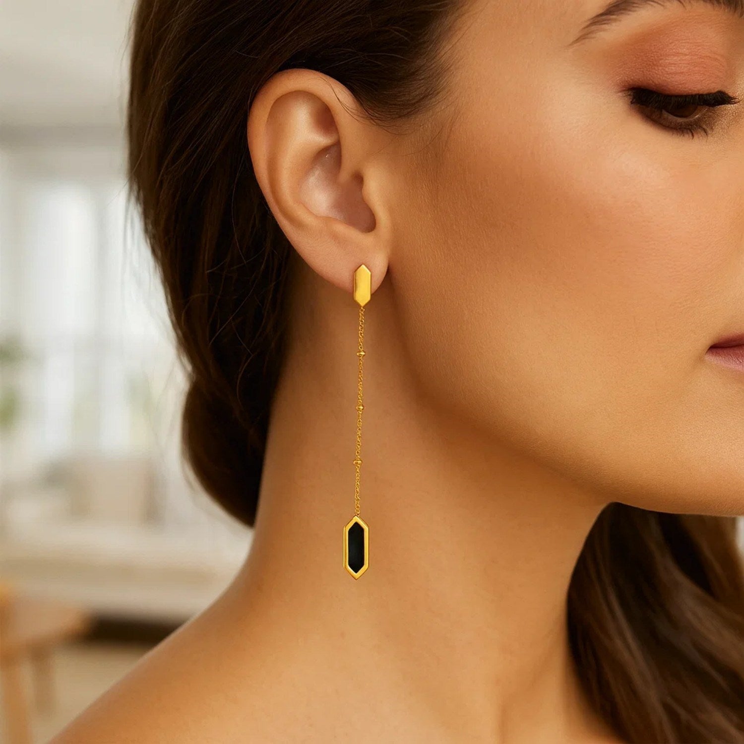 14K yellow gold hexagon onyx drop earrings with a delicate Saturn chain.