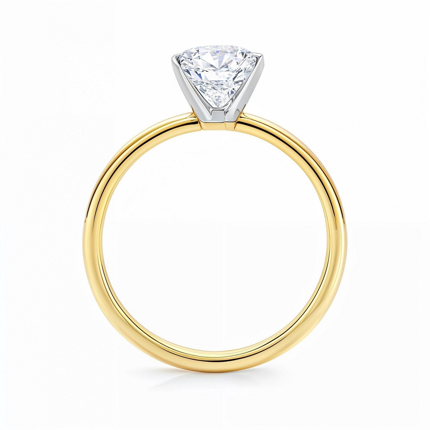 A 3 carat radiant lab grown diamond solitaire ring in 14K yellow gold.