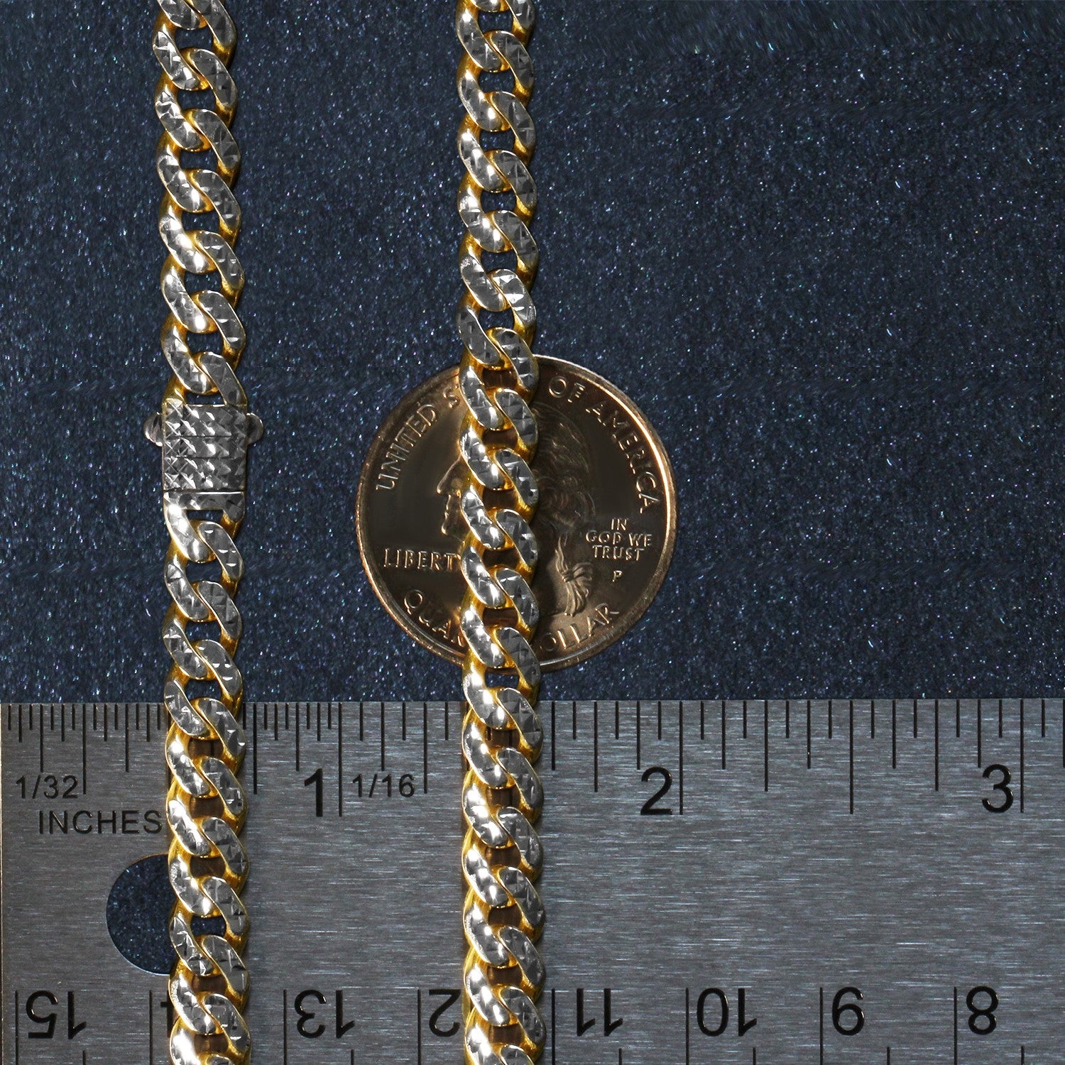 A 14k yellow gold and white pave Miami Cuban chain with a box clasp.