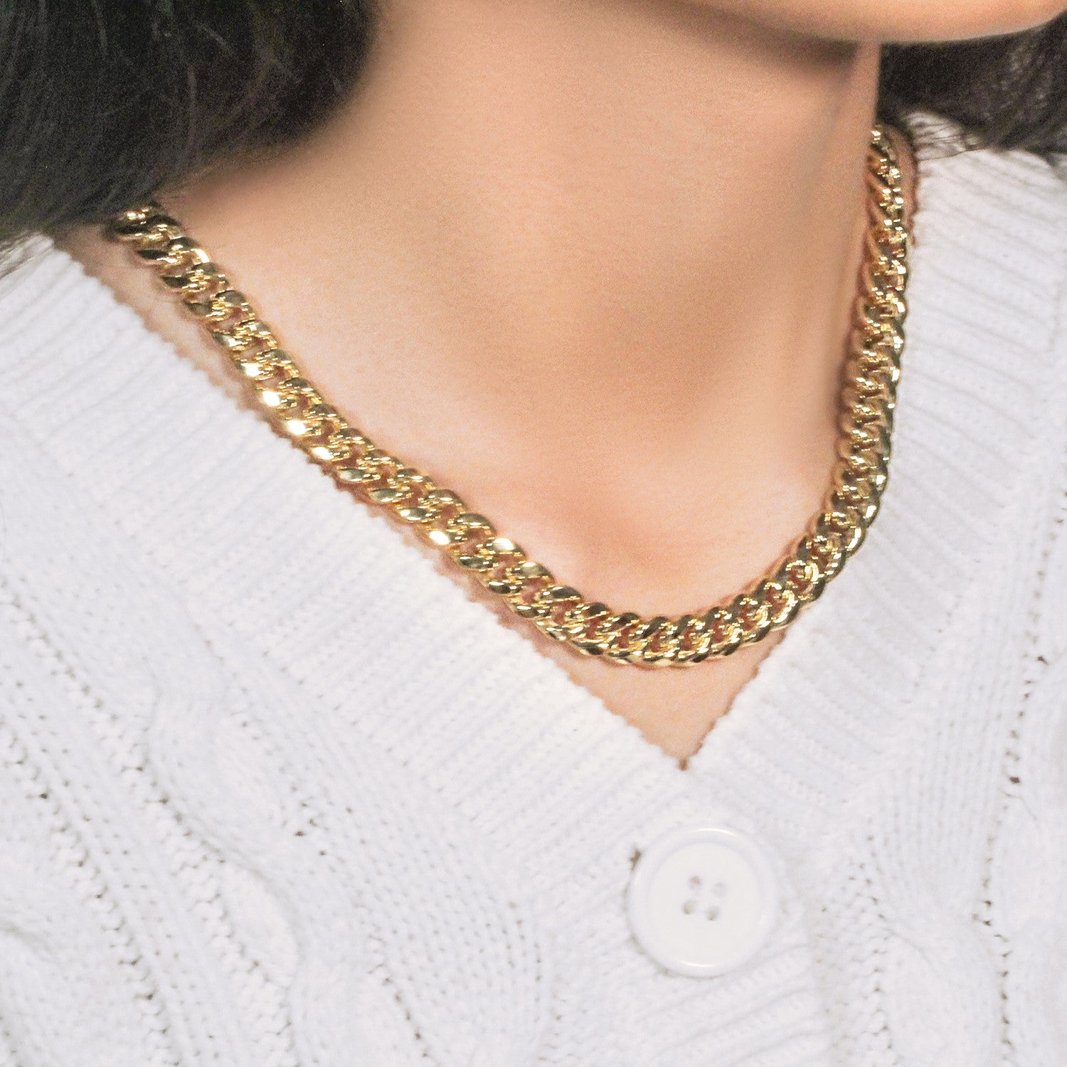 14k yellow gold semi-solid Miami Cuban chain, 9.10 mm wide, on a person.