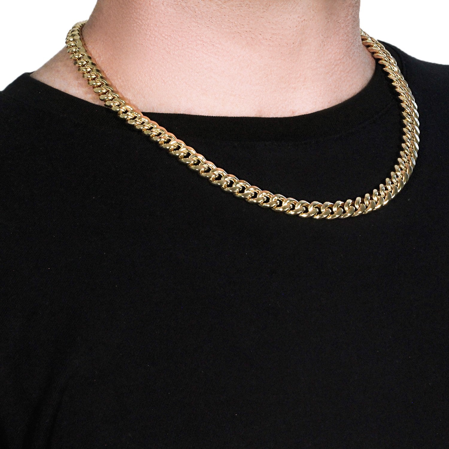 A 14k yellow gold semi-solid Miami Cuban chain, 9.10 mm wide, on a person's neck.