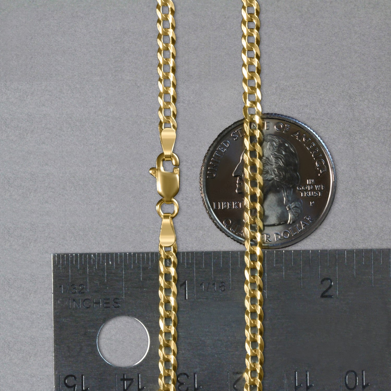 14k yellow gold solid curb chain with a lobster clasp, measured against a ruler and coin.