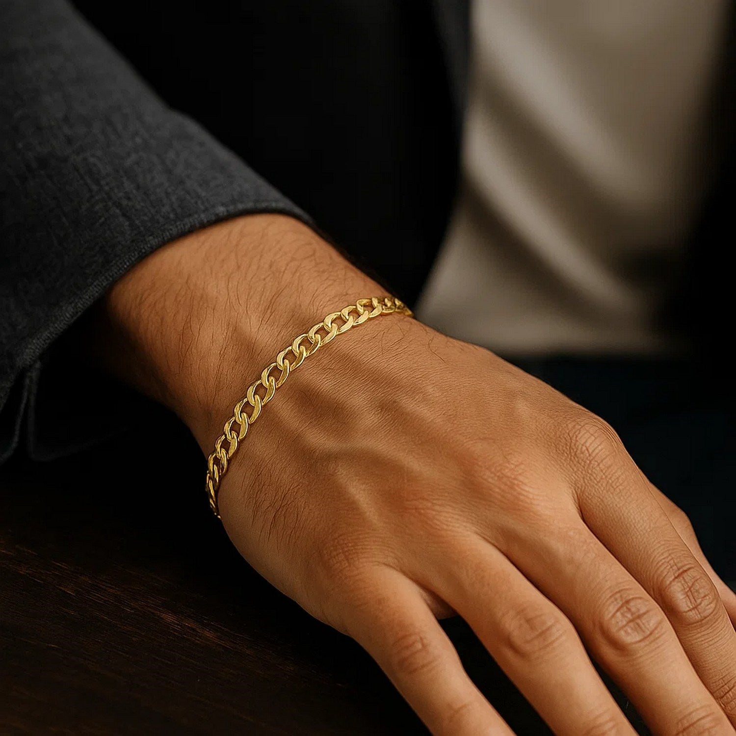 10k yellow gold curb bracelet on a person's wrist.