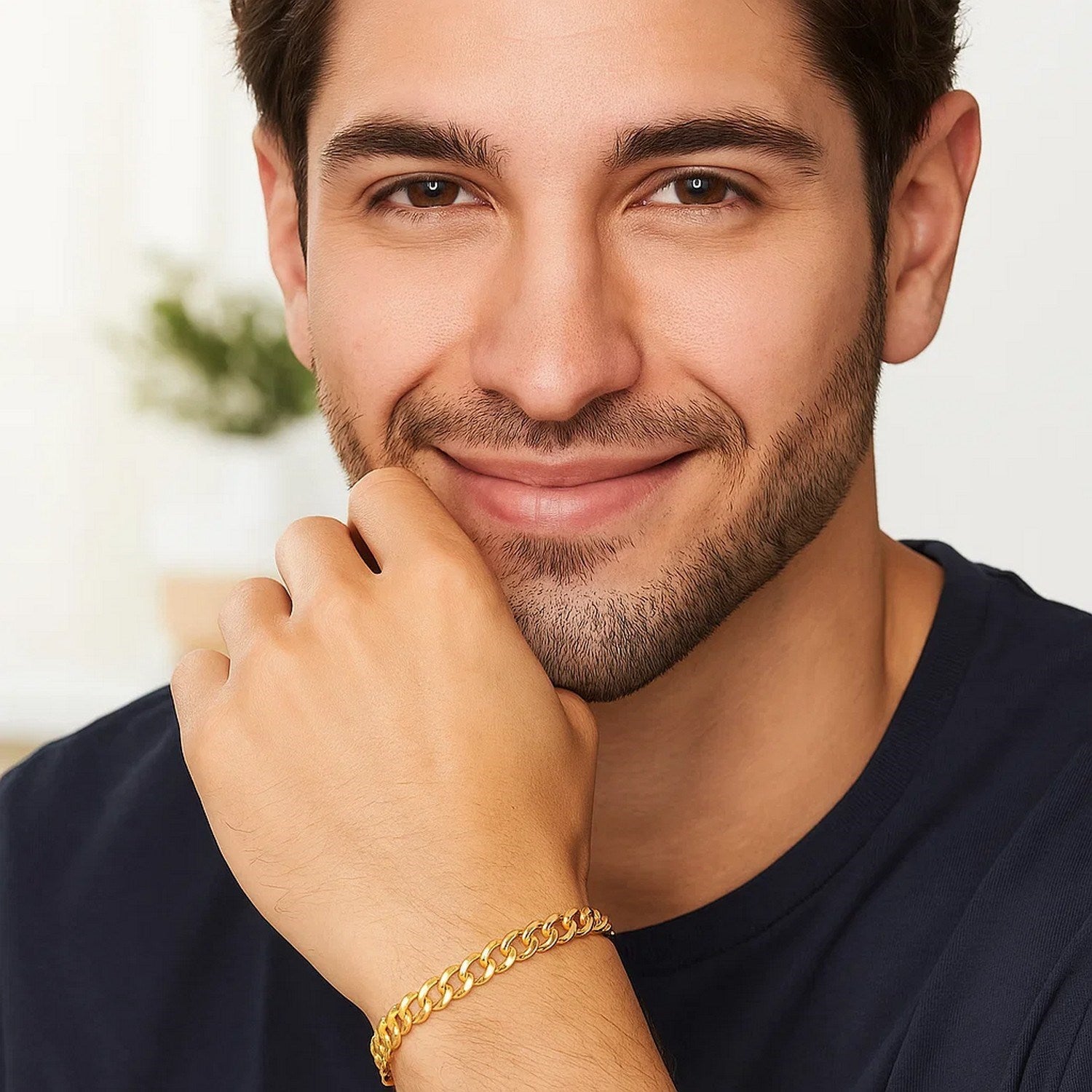 10k yellow gold curb bracelet on a man's wrist.