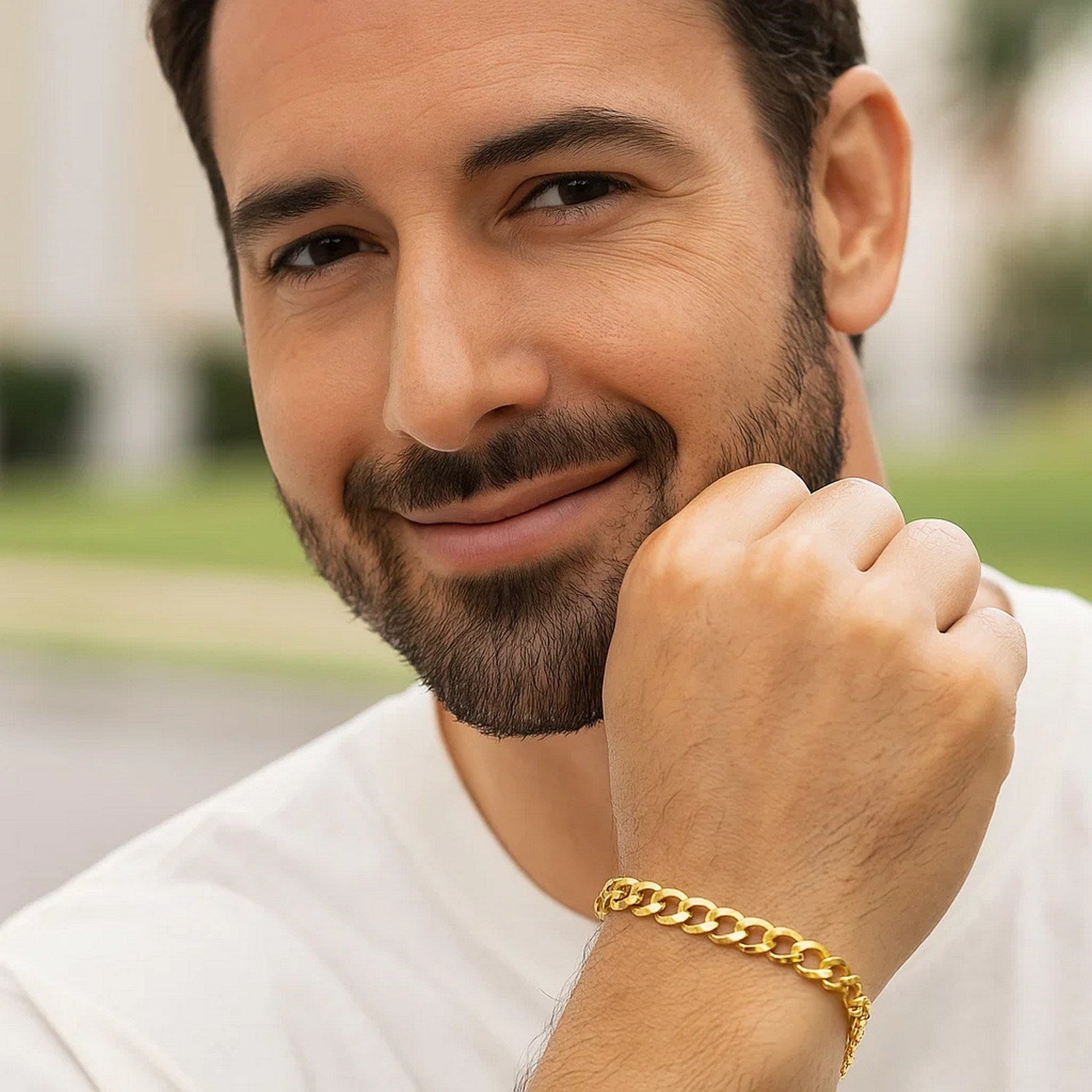 10k yellow gold curb bracelet on a man's wrist.