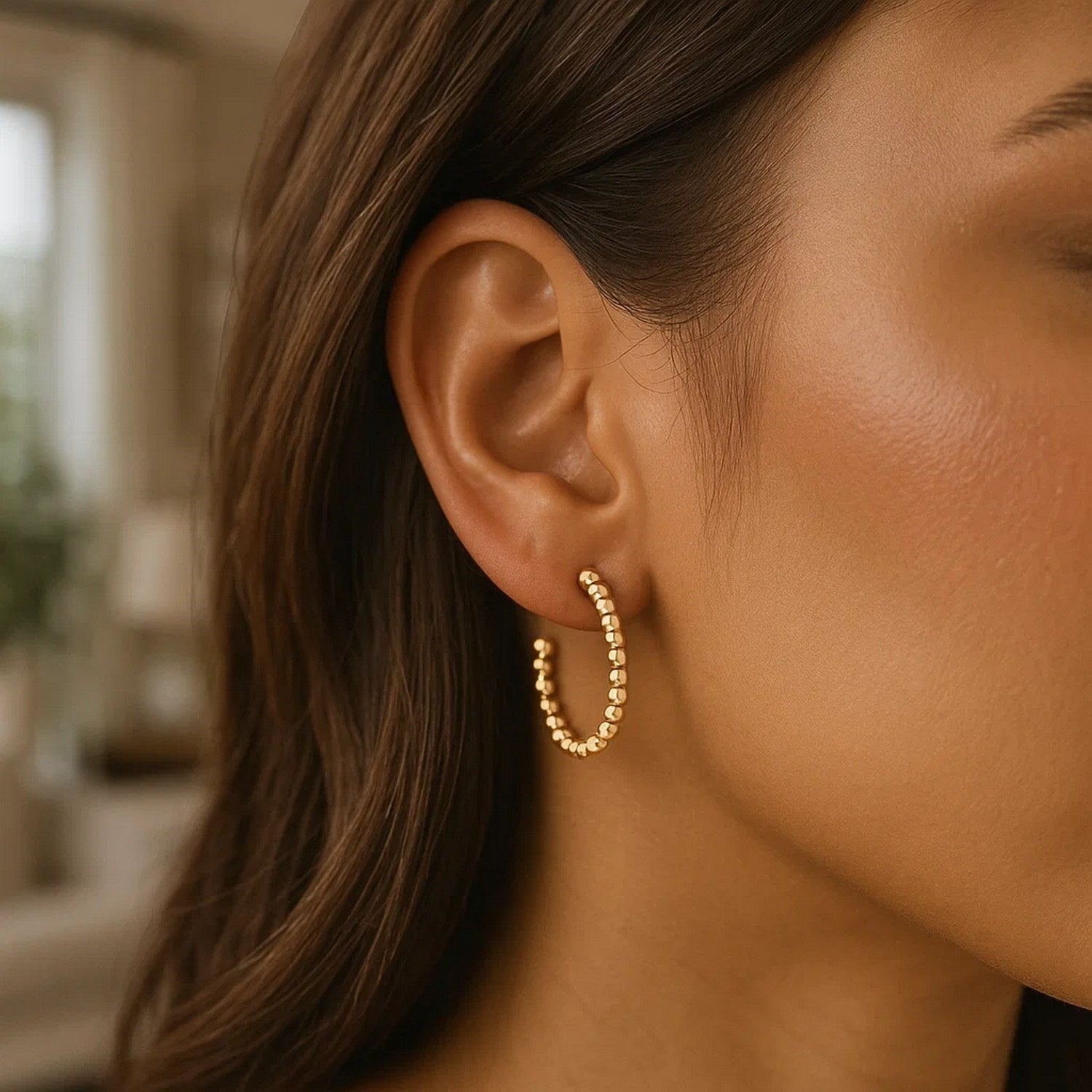 14K yellow gold bead hoop earrings with a push-back closure.