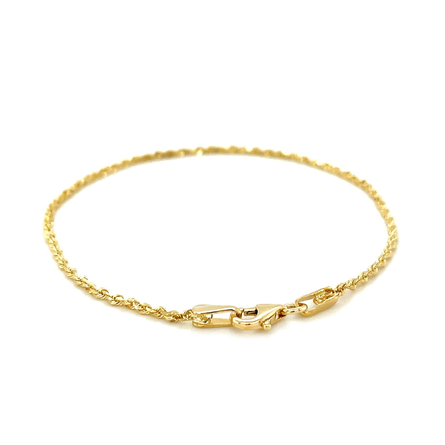 A 10k yellow gold solid diamond cut rope bracelet with a lobster clasp.