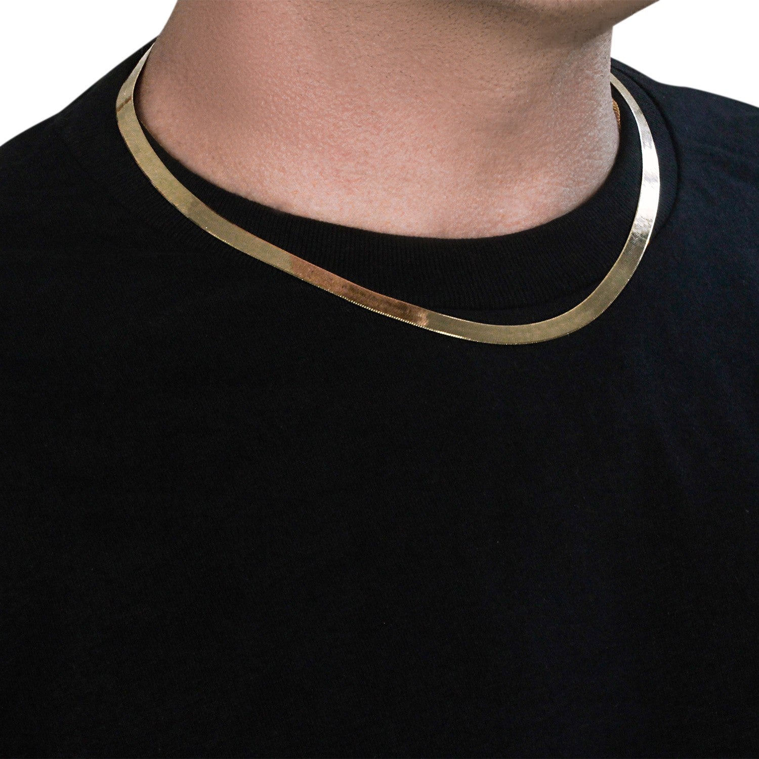 14k yellow gold super flex herringbone chain, 6.00 mm, worn on a person.