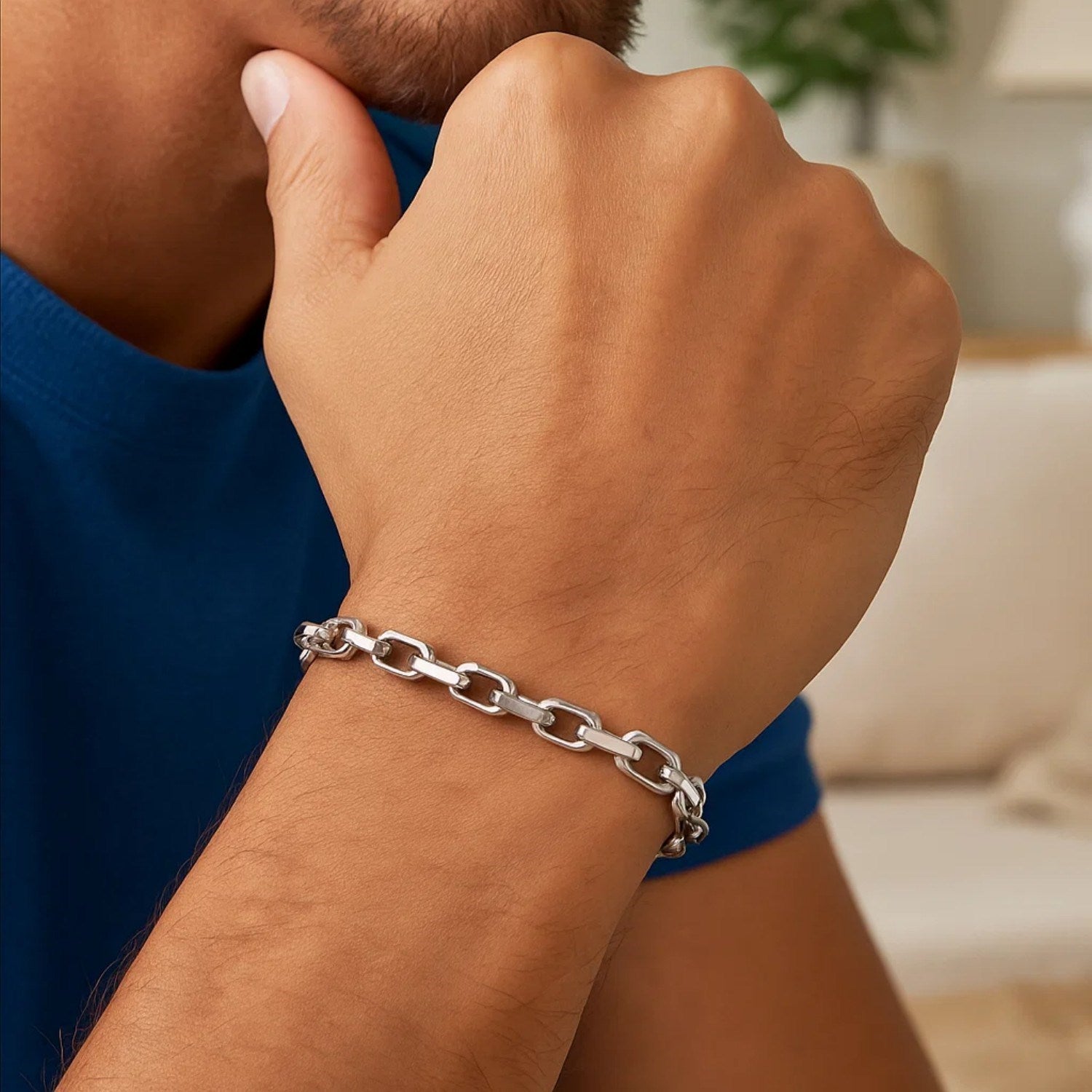 14k white gold French cable chain bracelet on a man's wrist.
