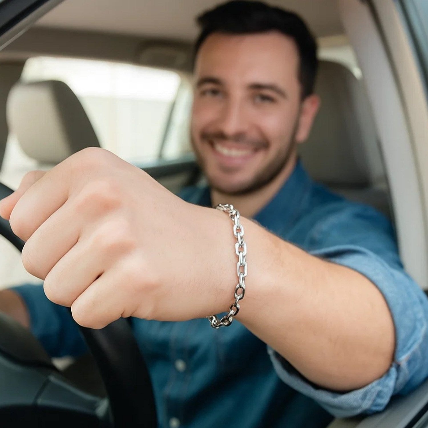 14k white gold French cable chain bracelet on a man's wrist.
