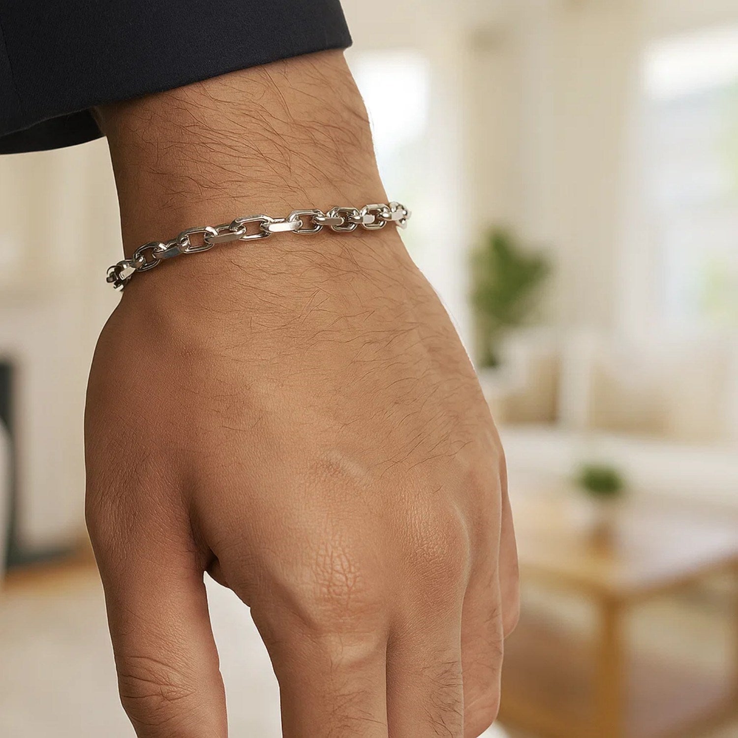 14k white gold French cable chain bracelet on a man's wrist.