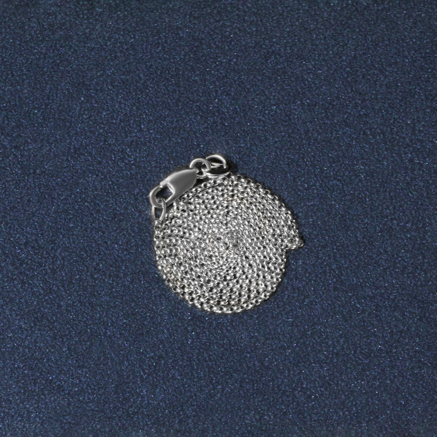 A coiled 14k white gold diamond-cut rolo chain with a lobster clasp.