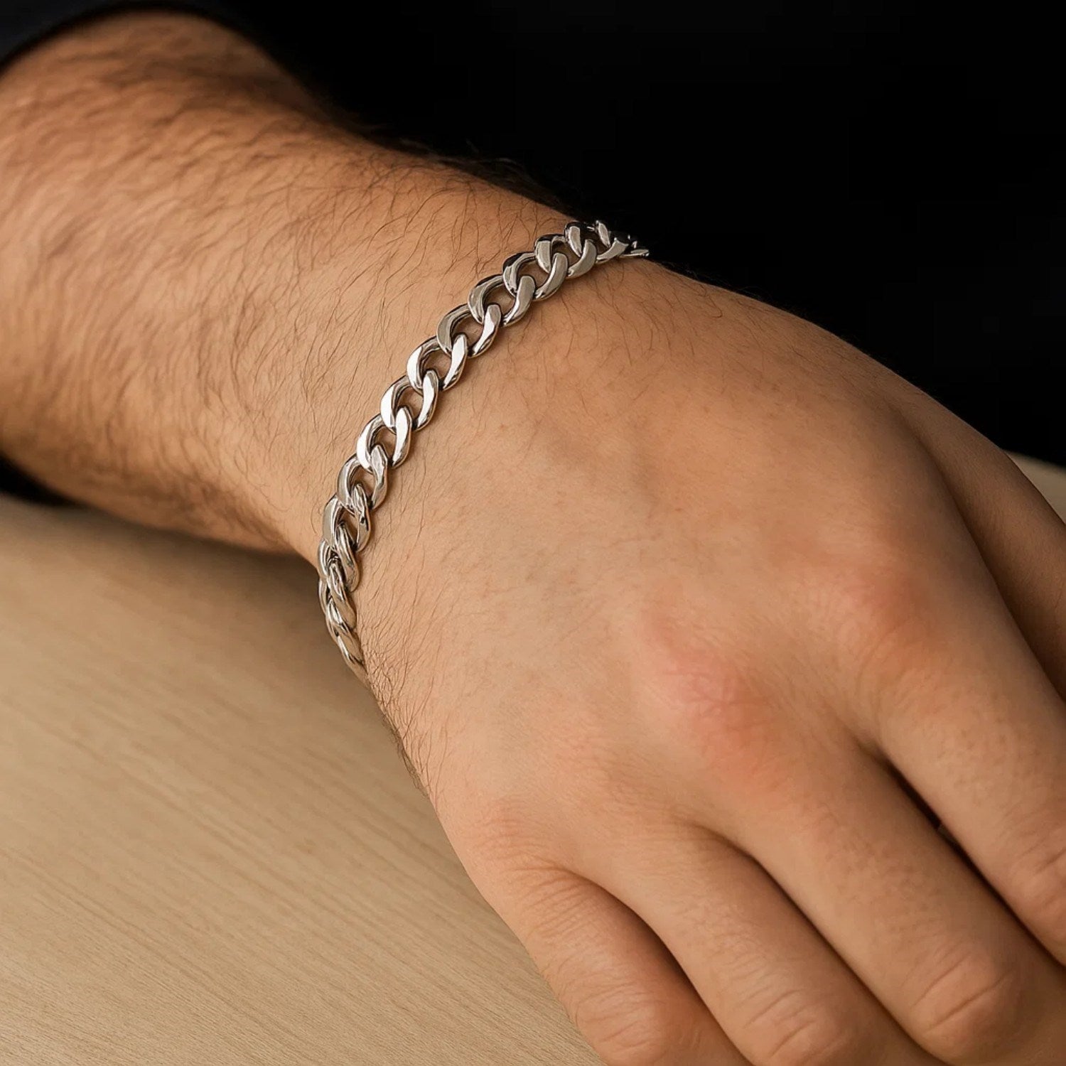 14k white gold Miami Cuban semi-solid bracelet on a person's wrist.