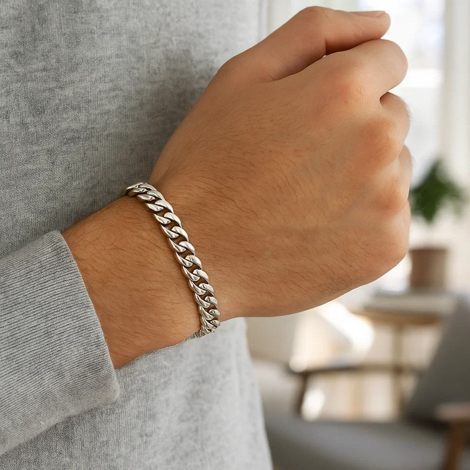 14k white gold Miami Cuban semi-solid bracelet on a man's wrist.