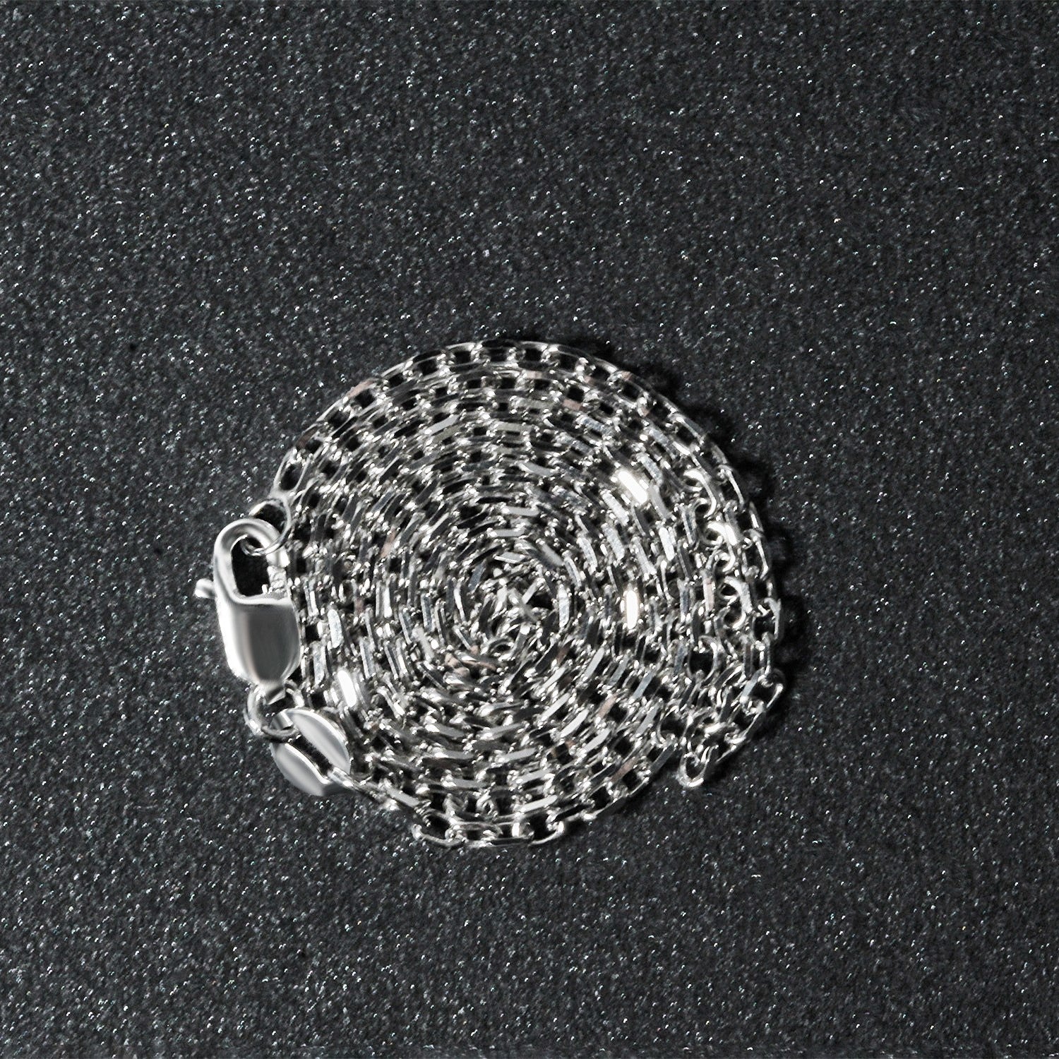 18k white gold diamond cut cable link chain with a lobster clasp.