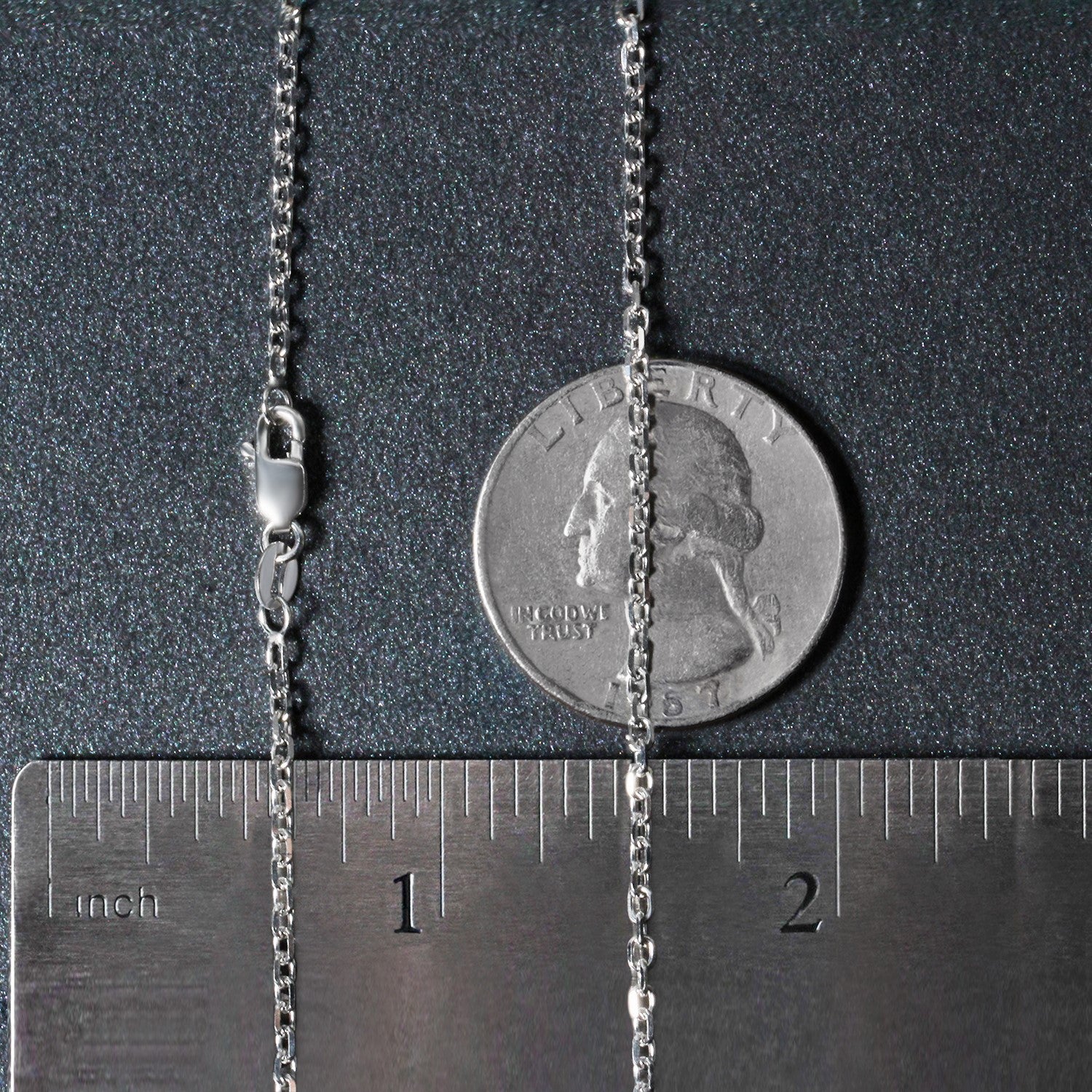 18k white gold diamond cut cable link chain with a lobster clasp, shown with a ruler and coin.