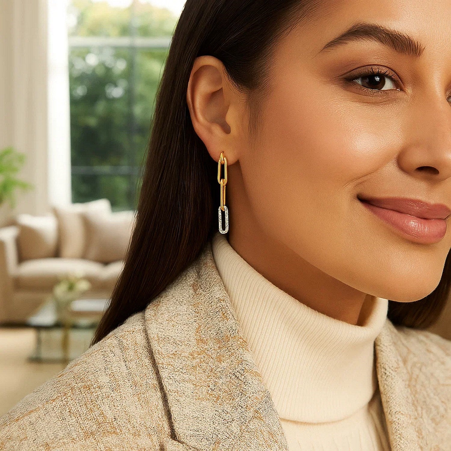 14k yellow gold paperclip chain dangle earrings with diamonds on a woman.