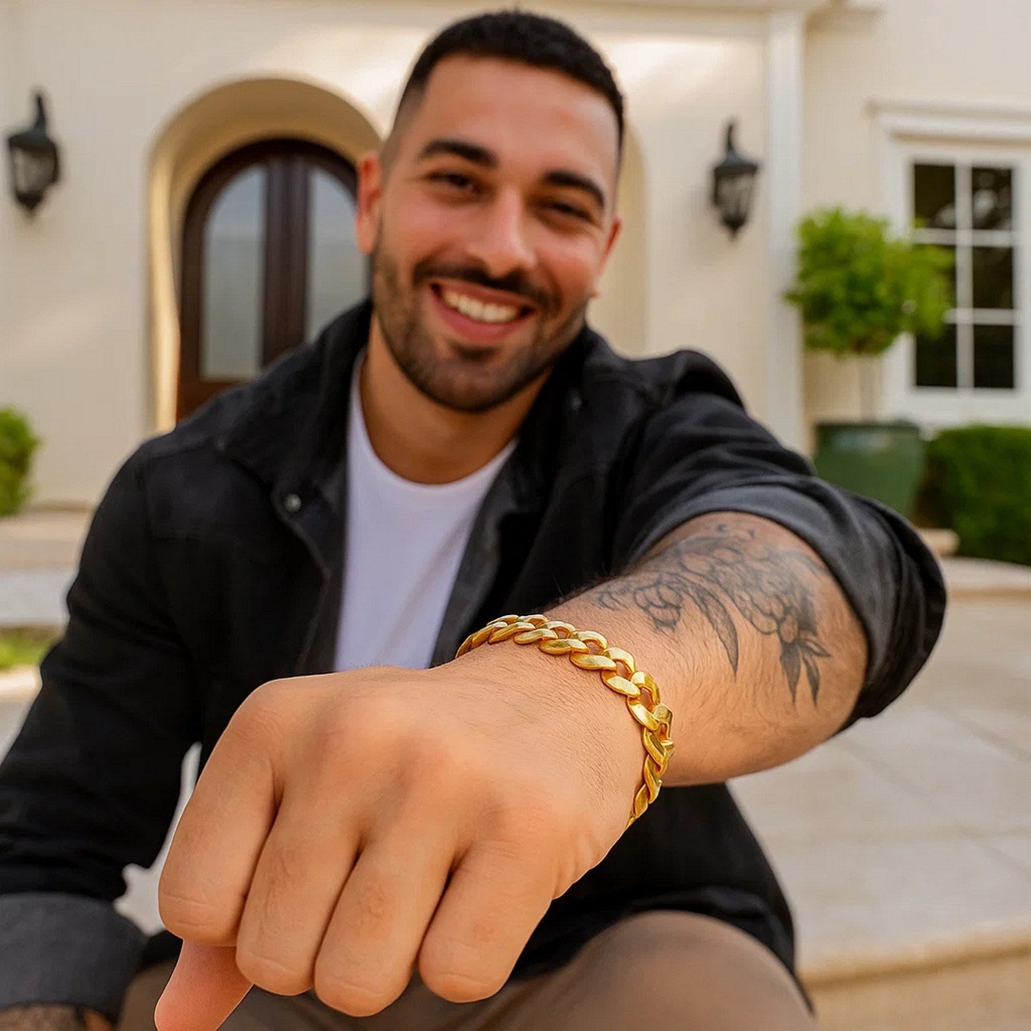 14k yellow gold solid curb bracelet on a man's wrist.