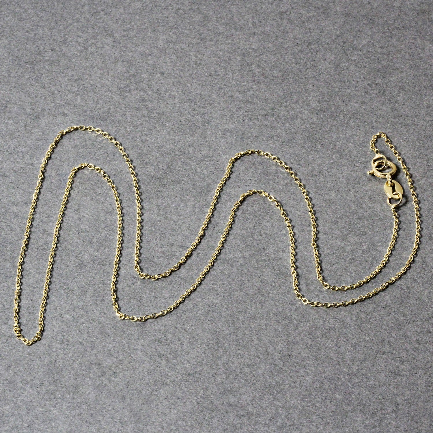 14k yellow gold diamond cut cable link chain with a spring ring clasp.