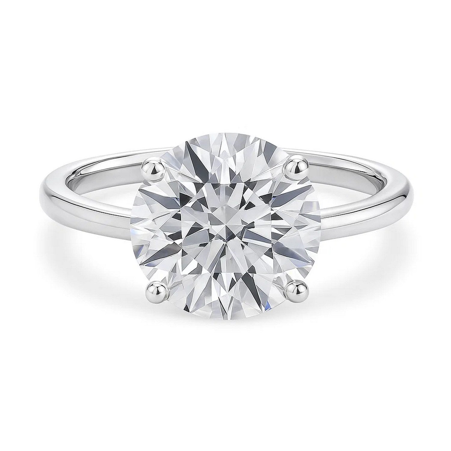 A 14K white gold solitaire ring with a large round diamond held by four prongs.