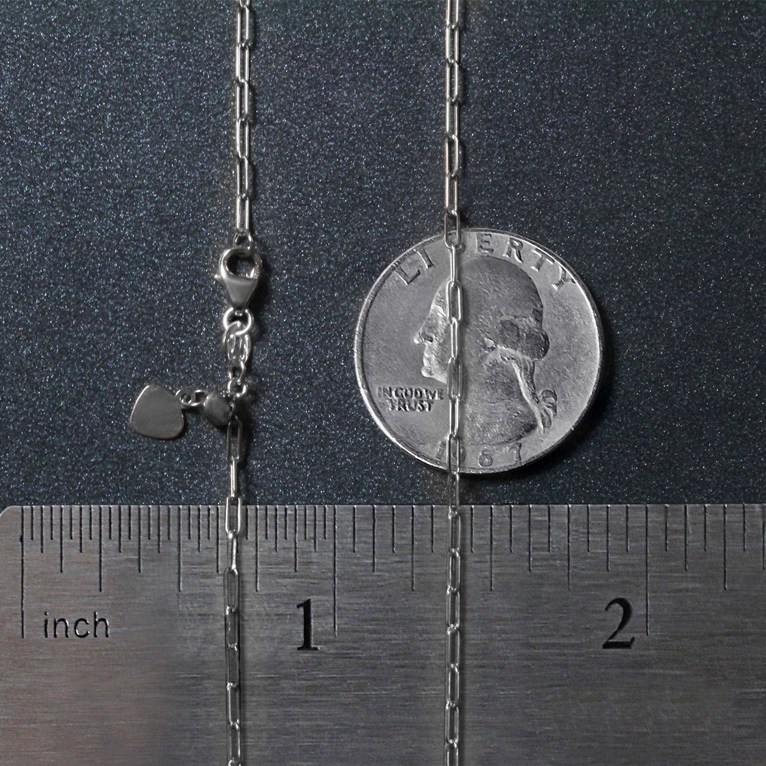 14k white gold adjustable paperclip chain with a heart dangle, shown with a ruler and coin.