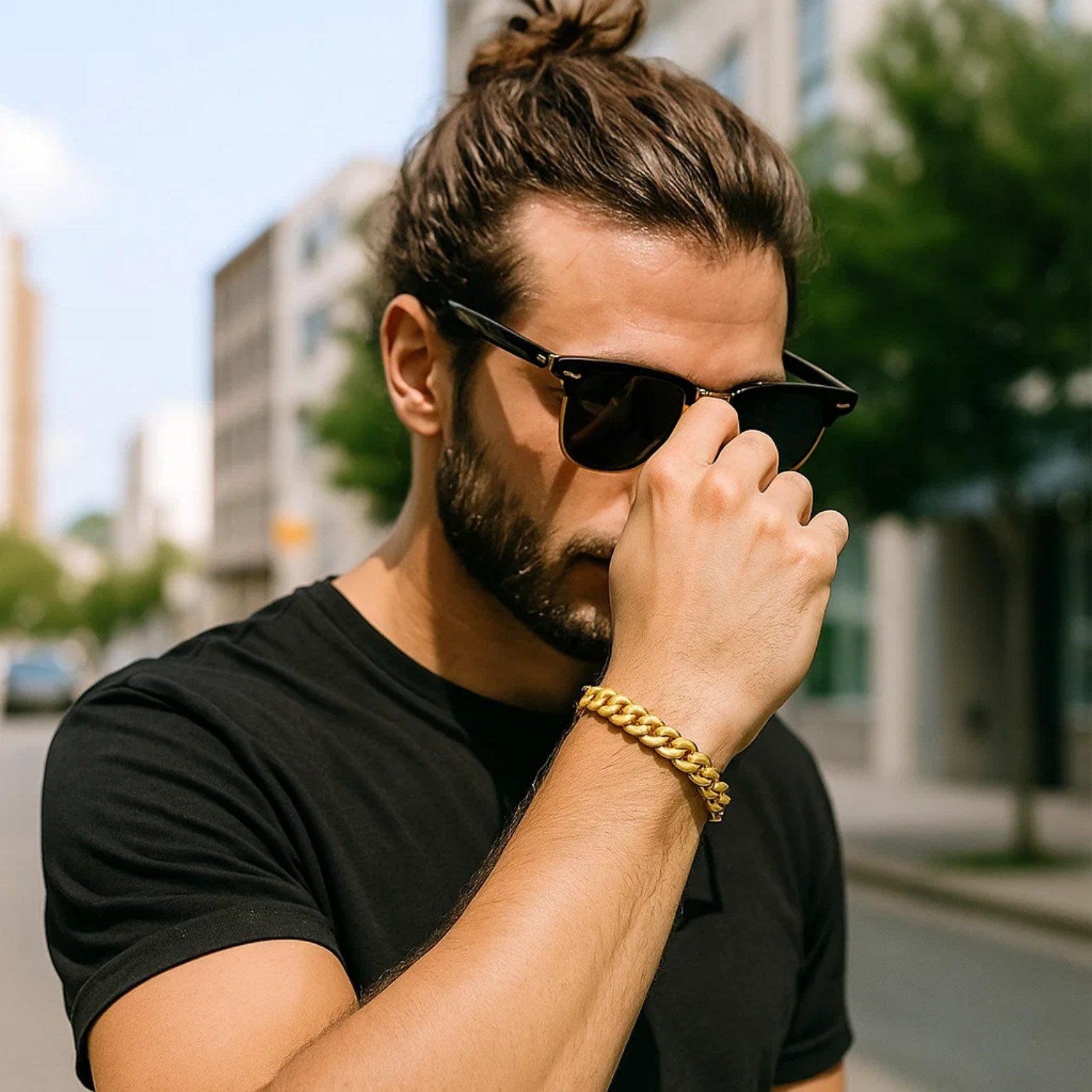 14k yellow gold classic Miami Cuban solid bracelet on a man's wrist.