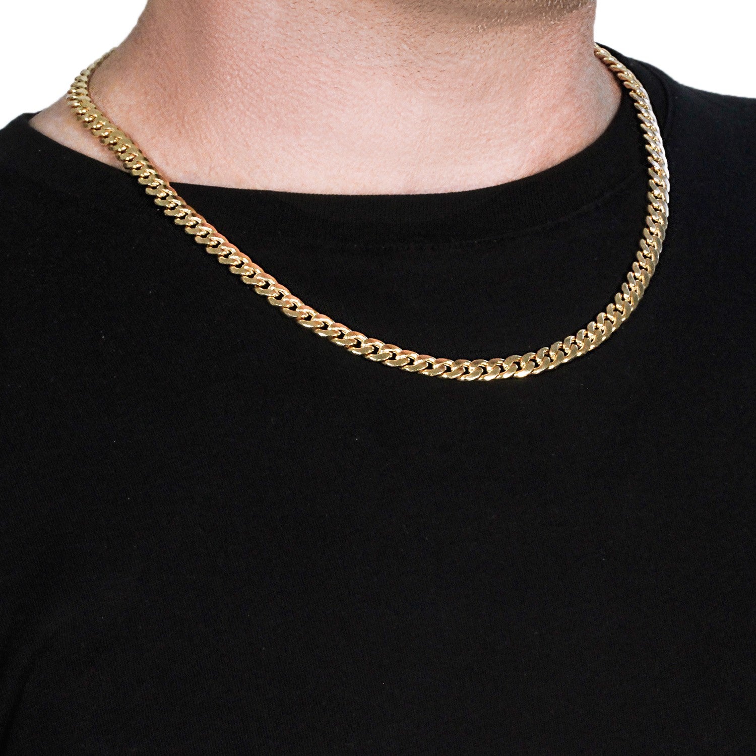 A 14k yellow gold Miami Cuban semi-solid chain, 7.00 mm wide, on a person.