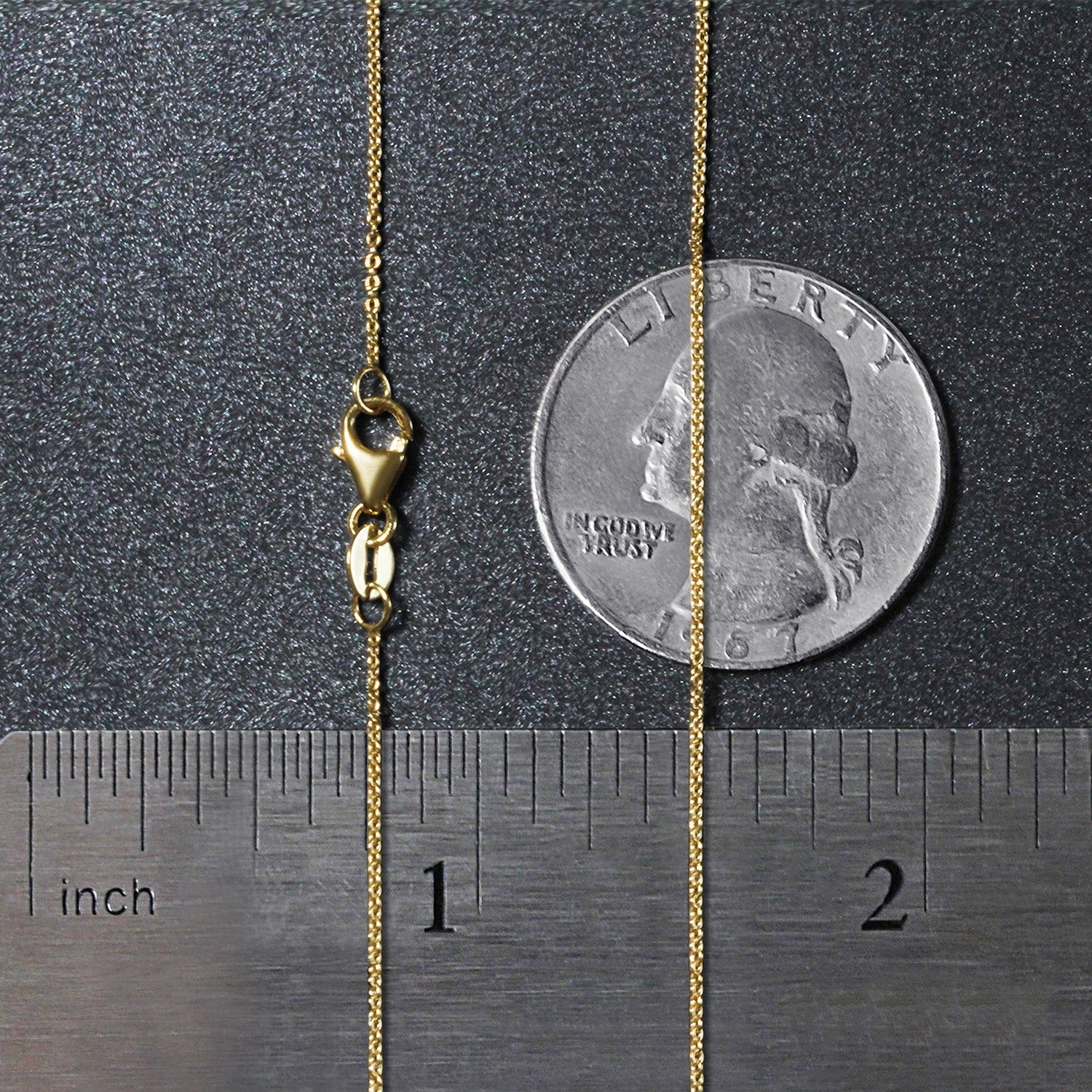 14k yellow gold 0.85 mm oval cable link chain with a lobster clasp.