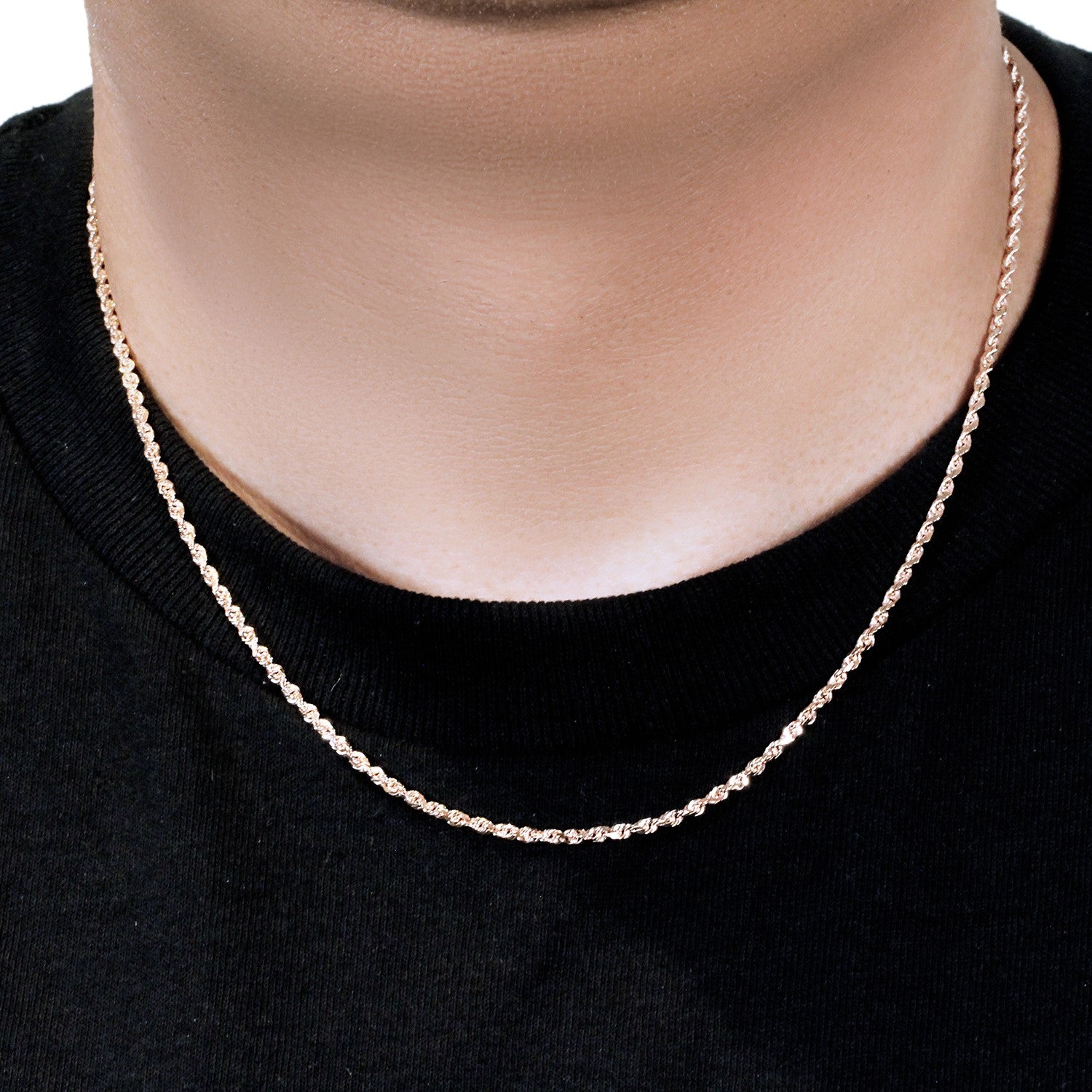 14k rose gold solid diamond cut rope chain on a person's neck.