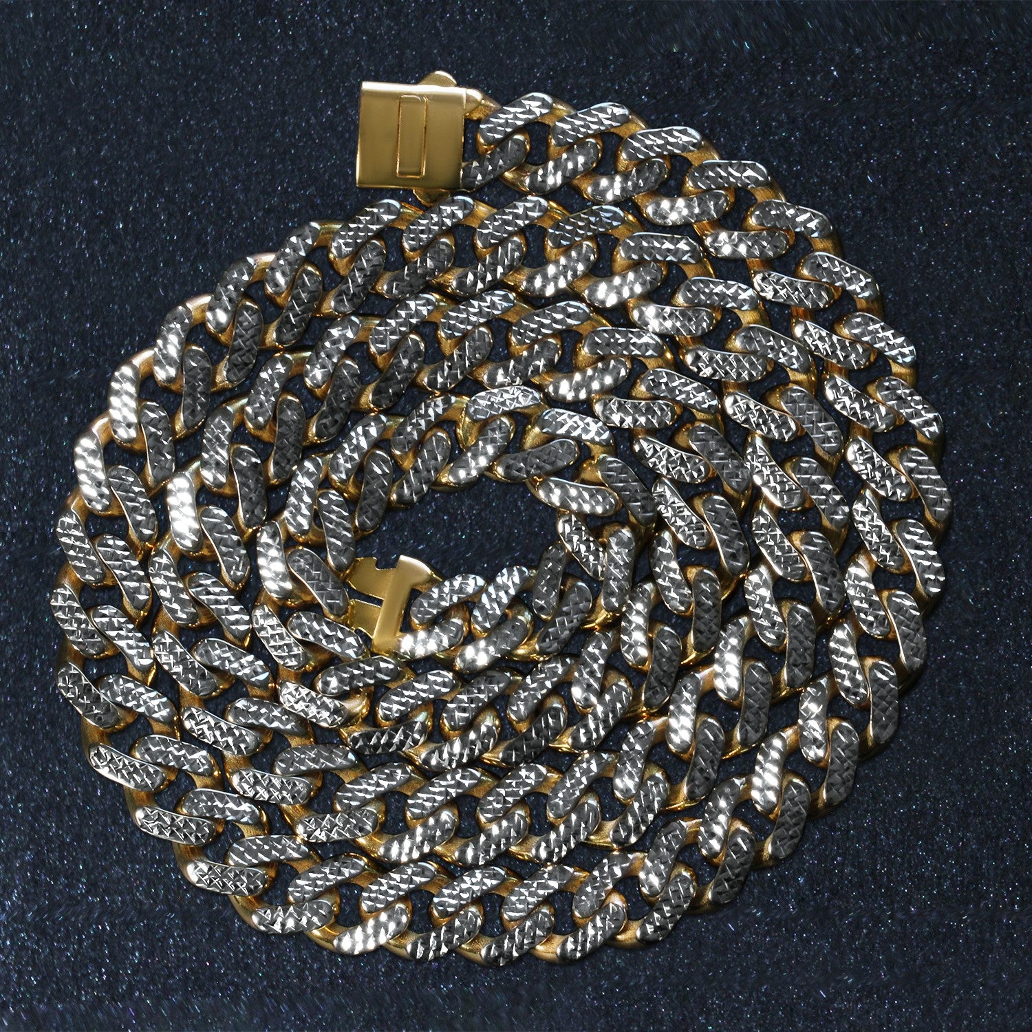 A two-tone gold Miami Cuban chain necklace with white pave and a box clasp.