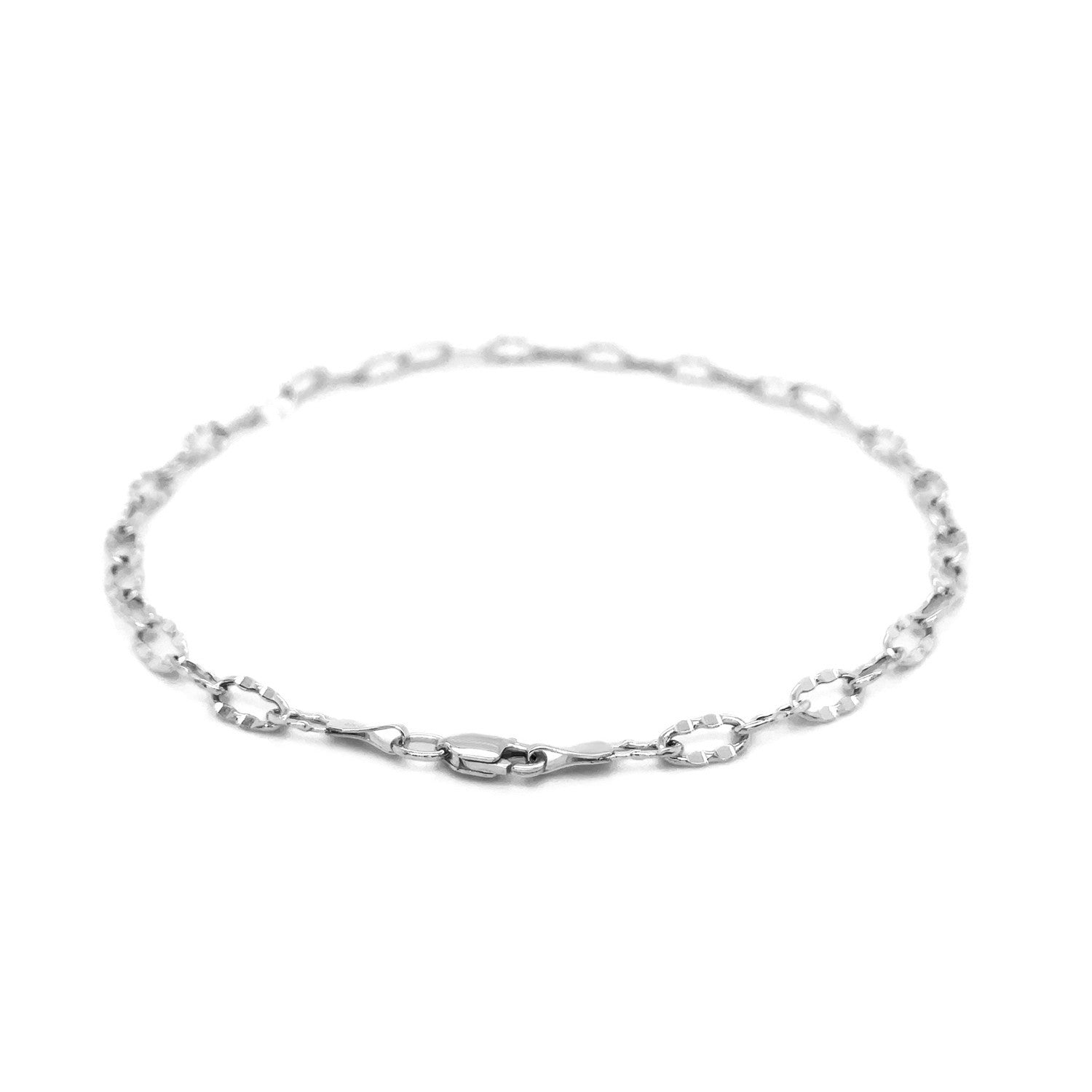 14k white gold anklet with fancy hammered oval links and a lobster clasp.