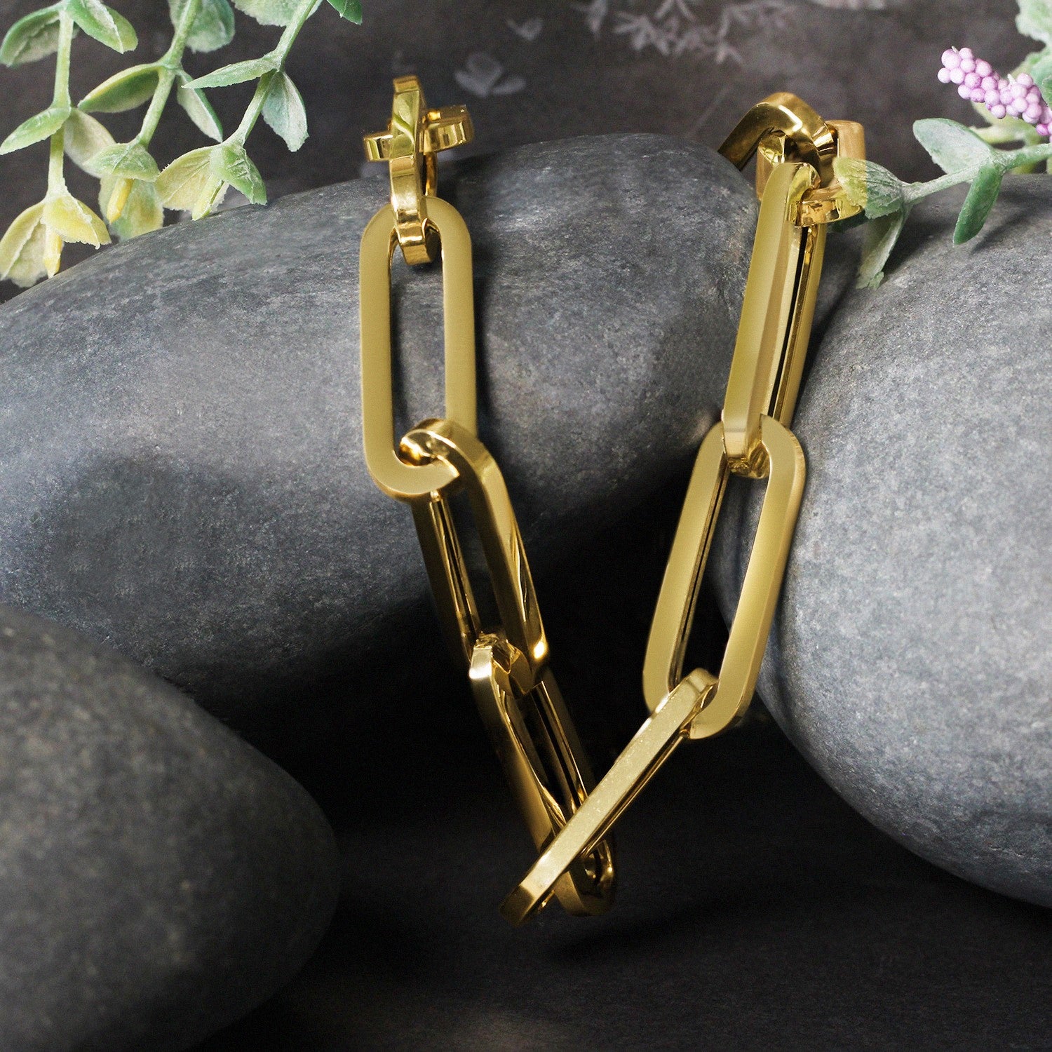 14k yellow gold extra wide paperclip chain necklace with a lobster clasp.