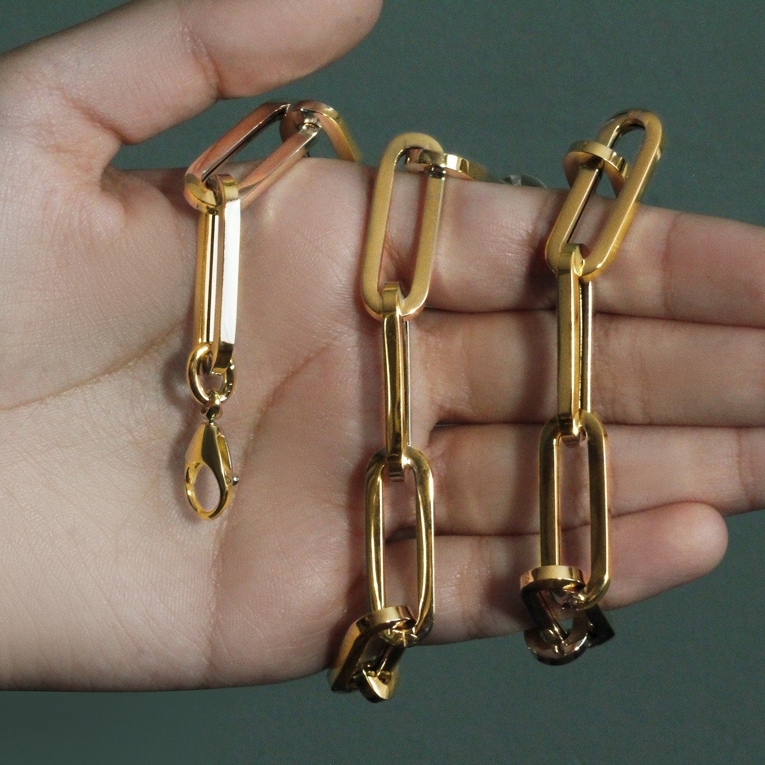 14k yellow gold extra wide paperclip chain necklace with a lobster clasp.