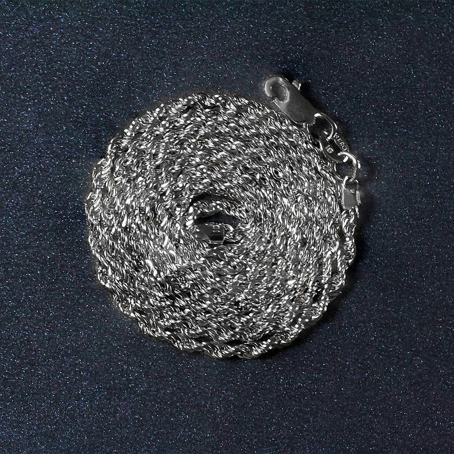 A coiled 14k white gold light rope chain with a lobster clasp.