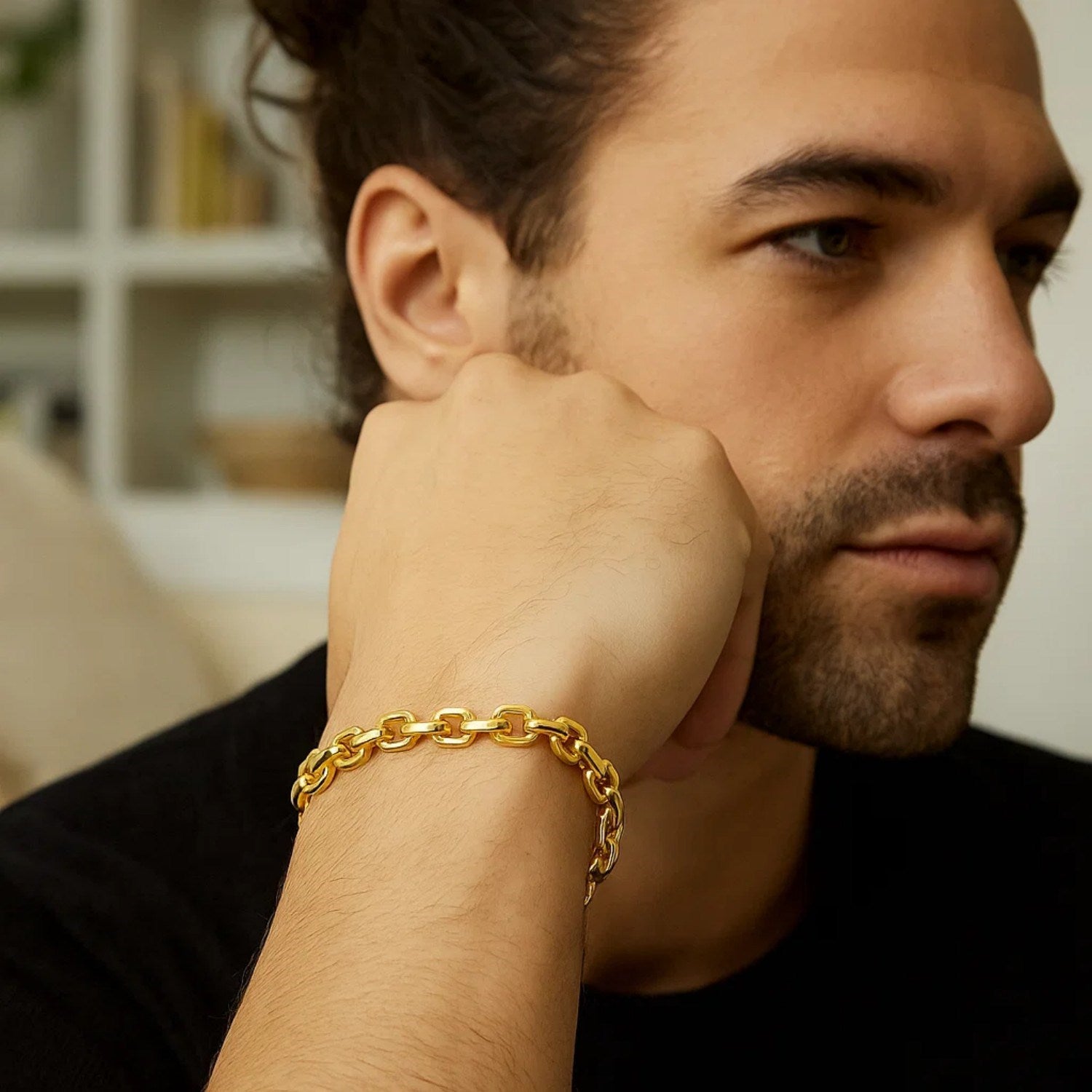 14k yellow gold French cable chain bracelet on a man's wrist.