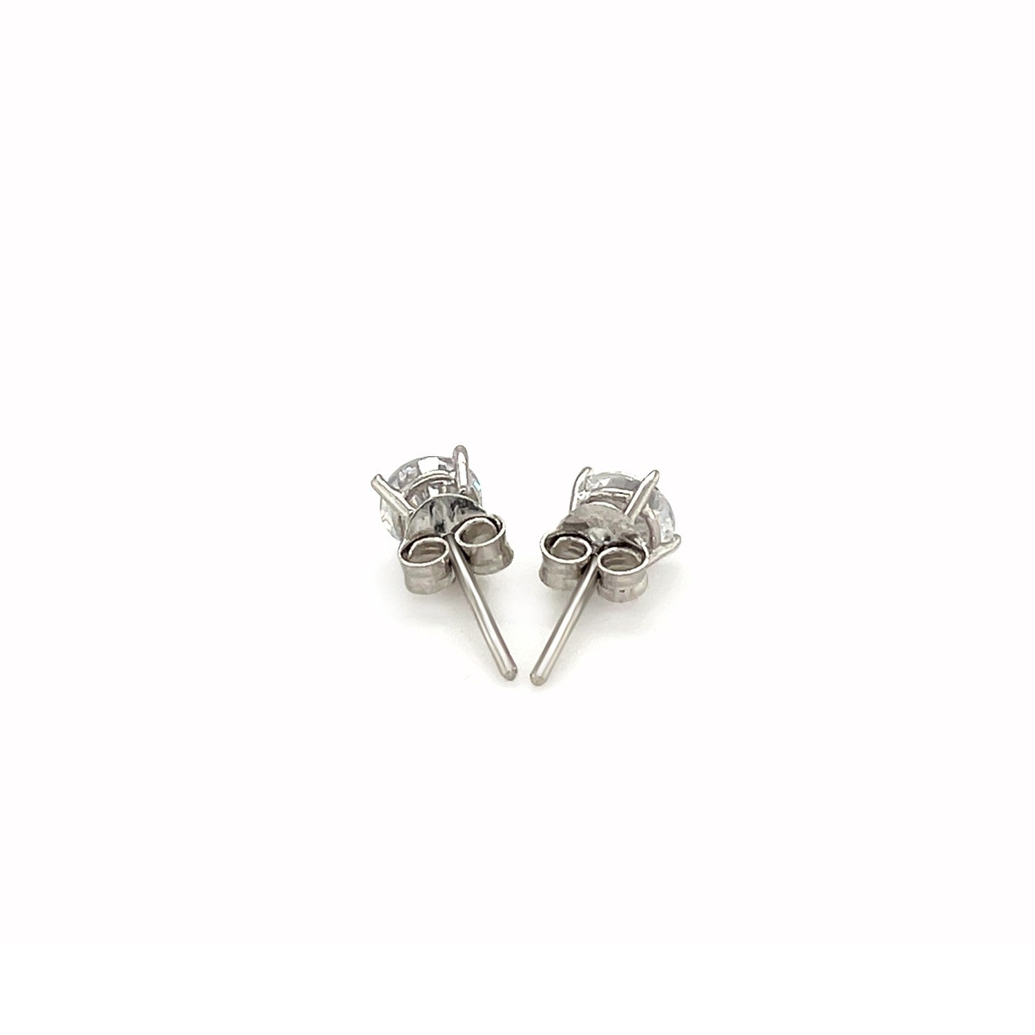 A pair of sterling silver stud earrings with white faceted cubic zirconia.