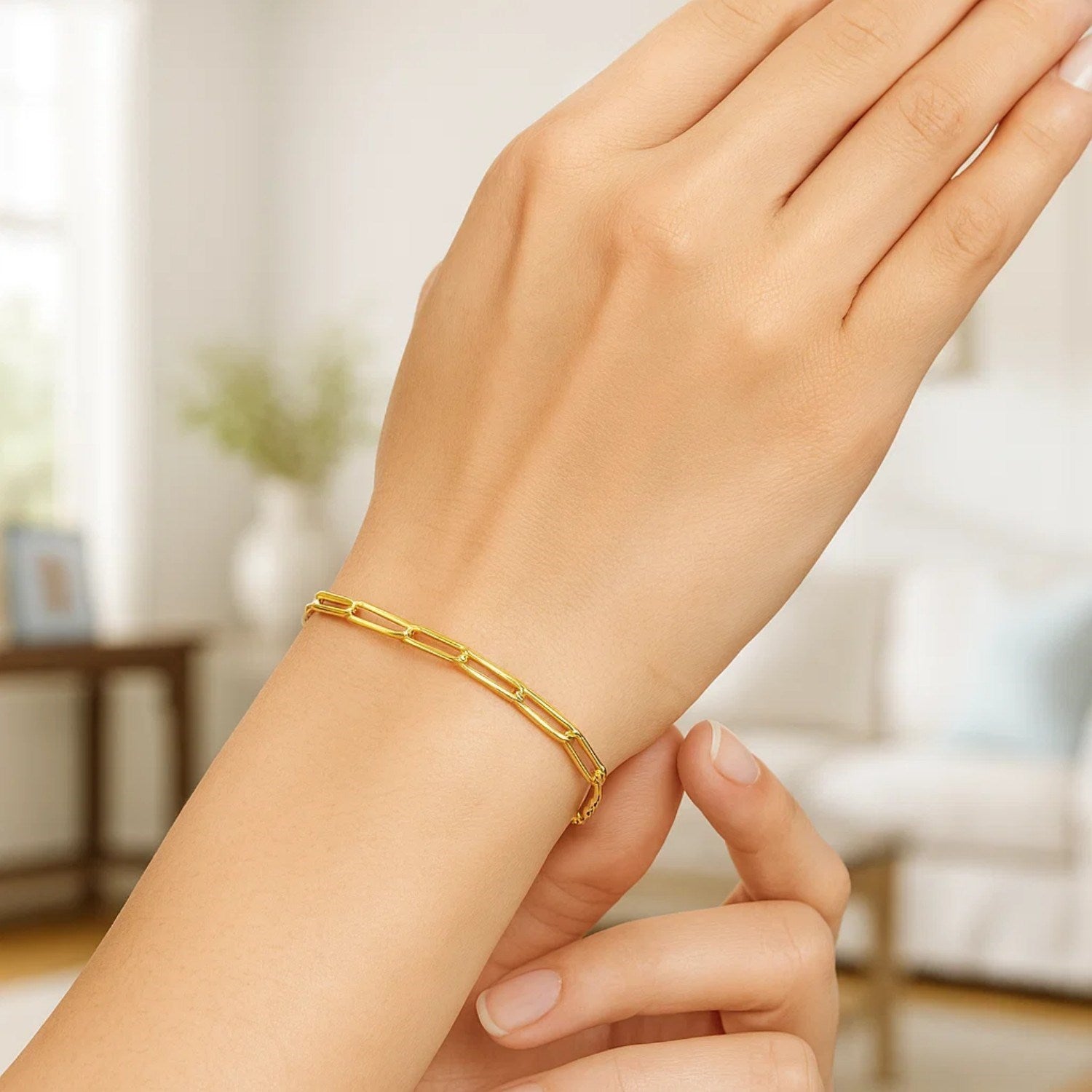 10K yellow gold paperclip bracelet with 2.50 mm links on a person's wrist.