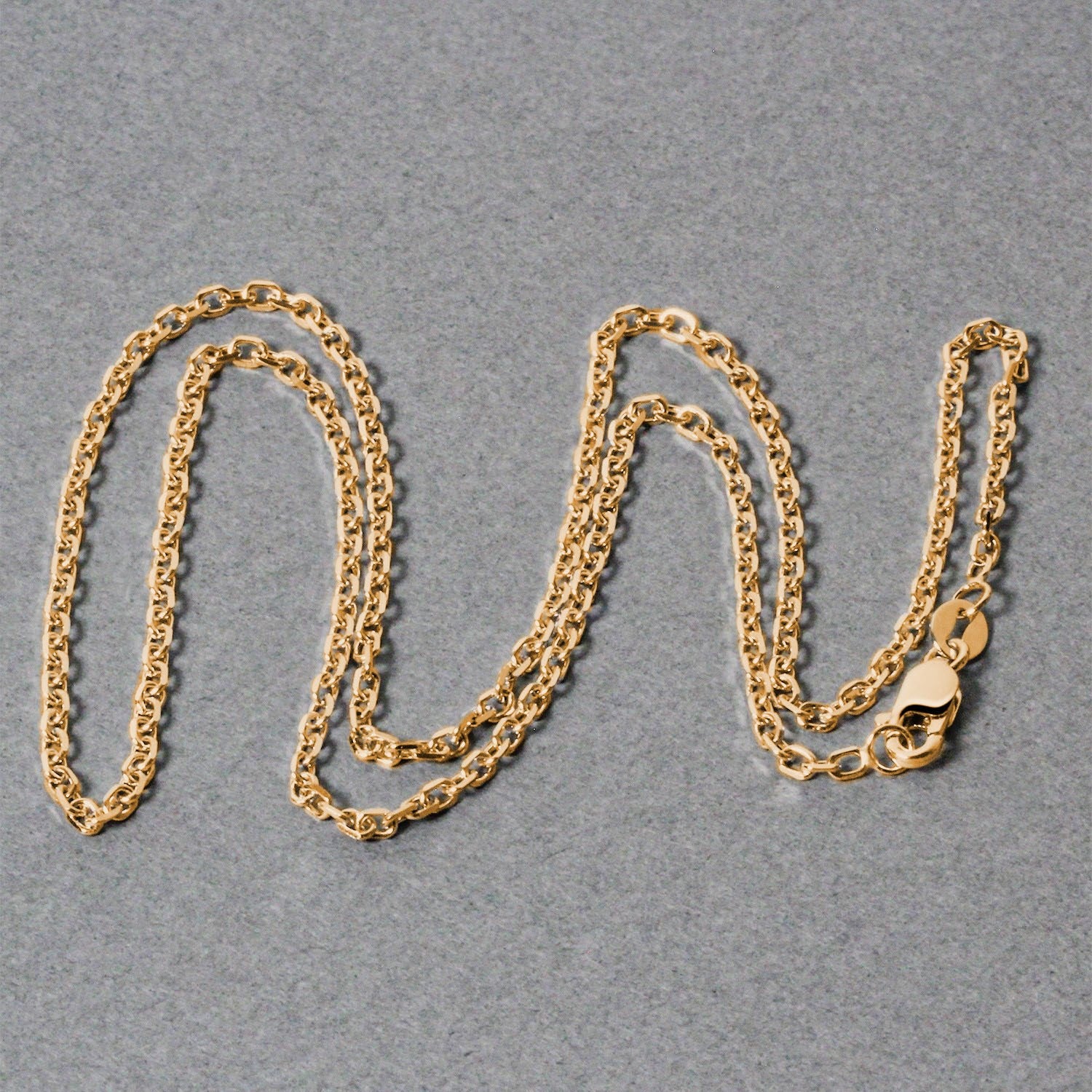 18k yellow gold diamond cut cable link chain with a lobster clasp.