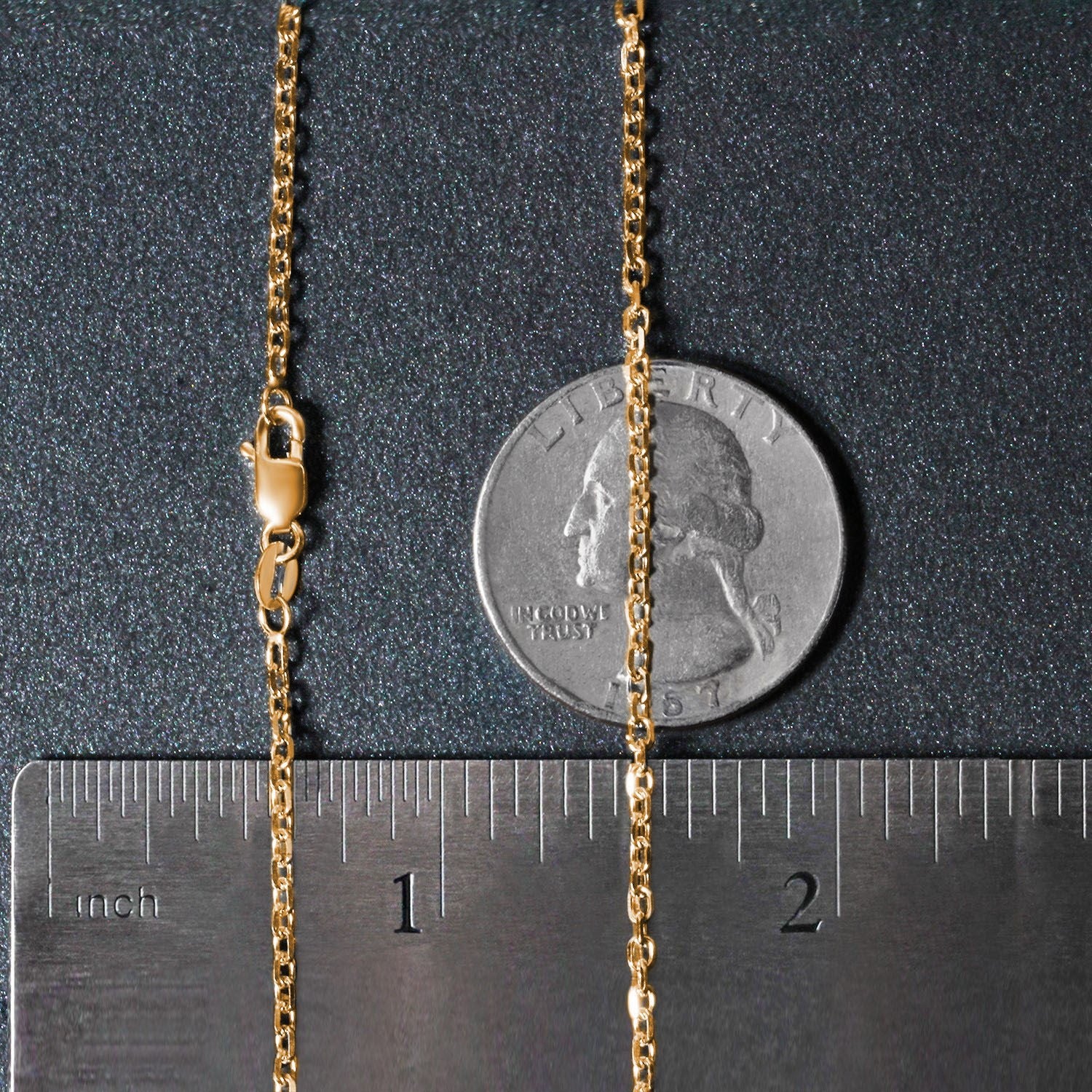 An 18k yellow gold diamond cut cable link chain with a lobster clasp.