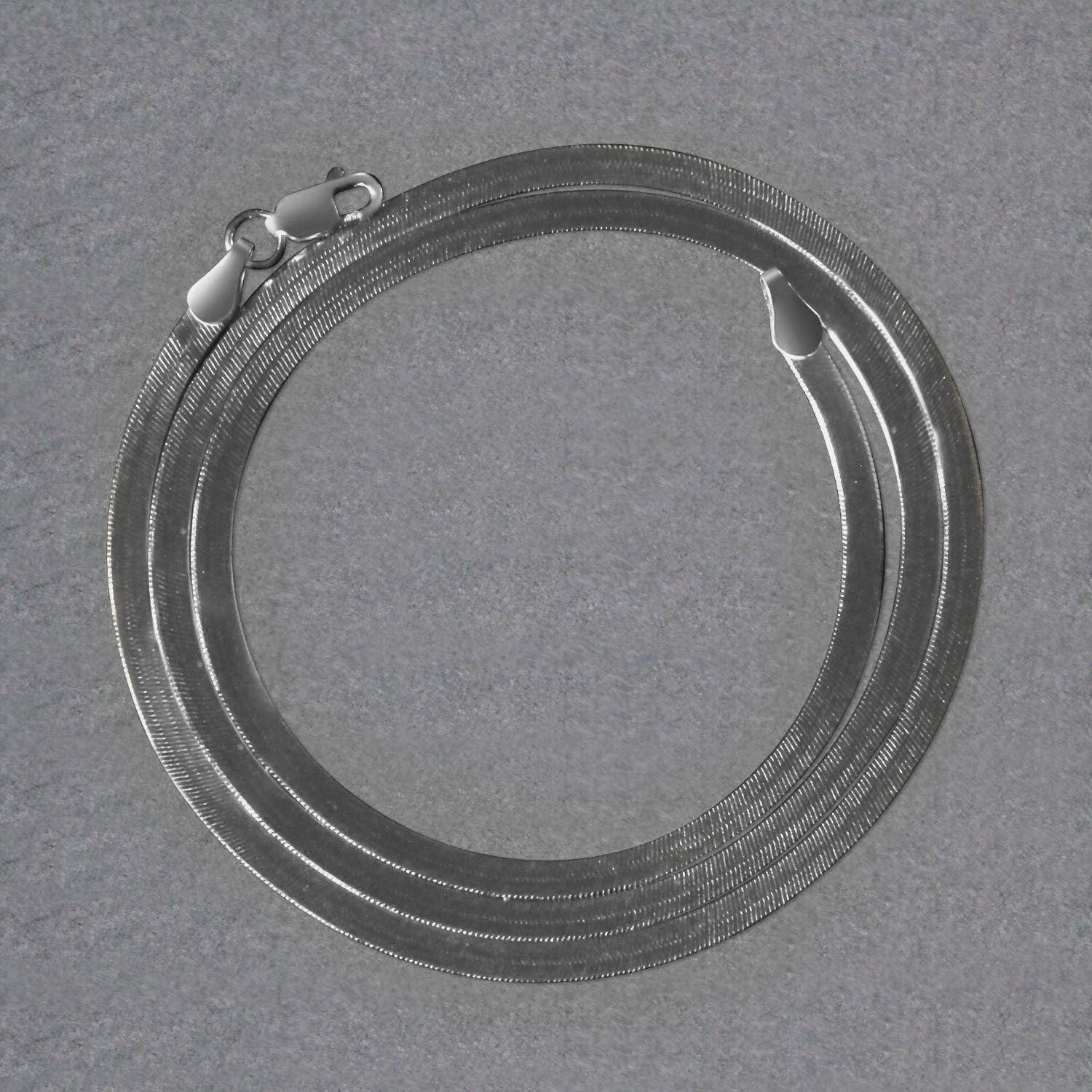 14k white gold super flex herringbone chain with a lobster clasp.
