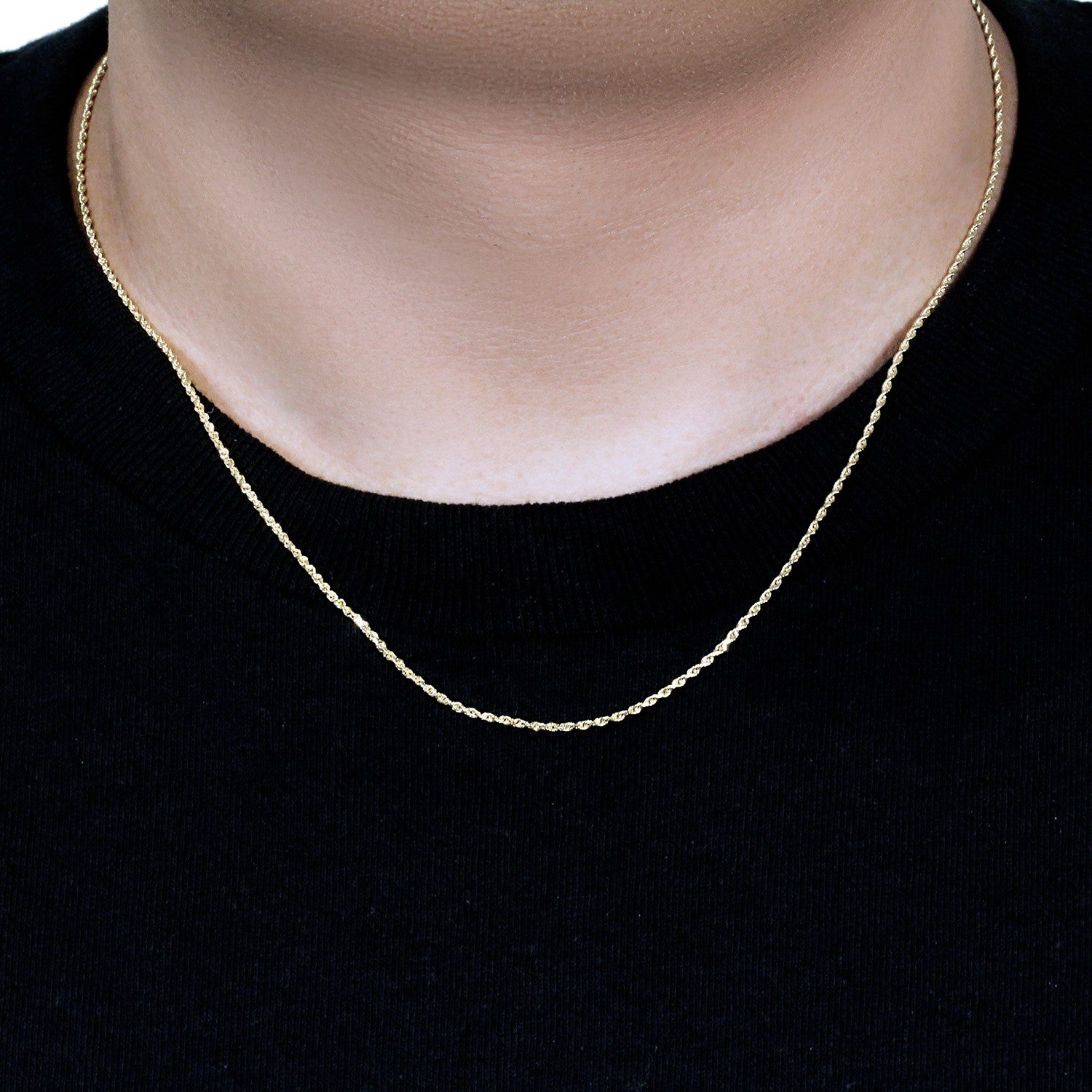 A 10k yellow gold solid diamond cut rope chain on a person's neck.