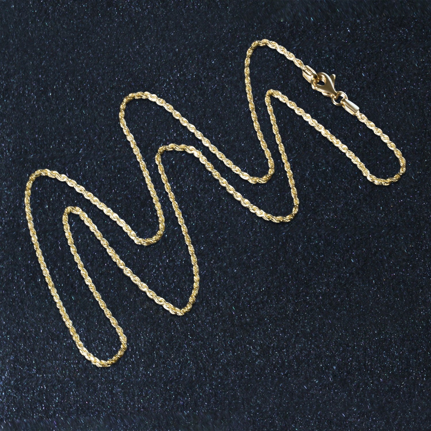 A 10k yellow gold solid diamond cut rope chain with a lobster clasp.