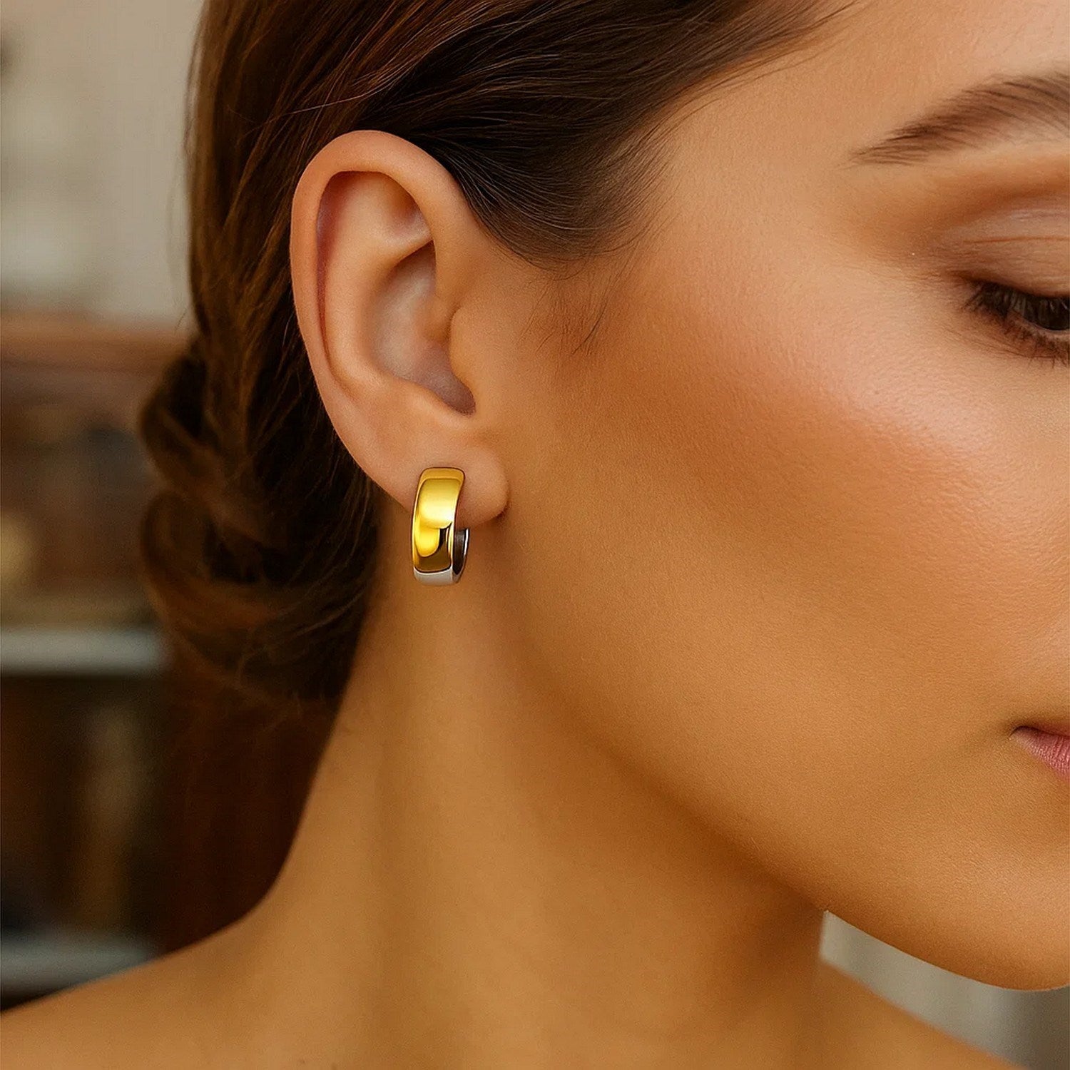 14k two-tone gold snuggable style hoop earrings with a hinged snap back.