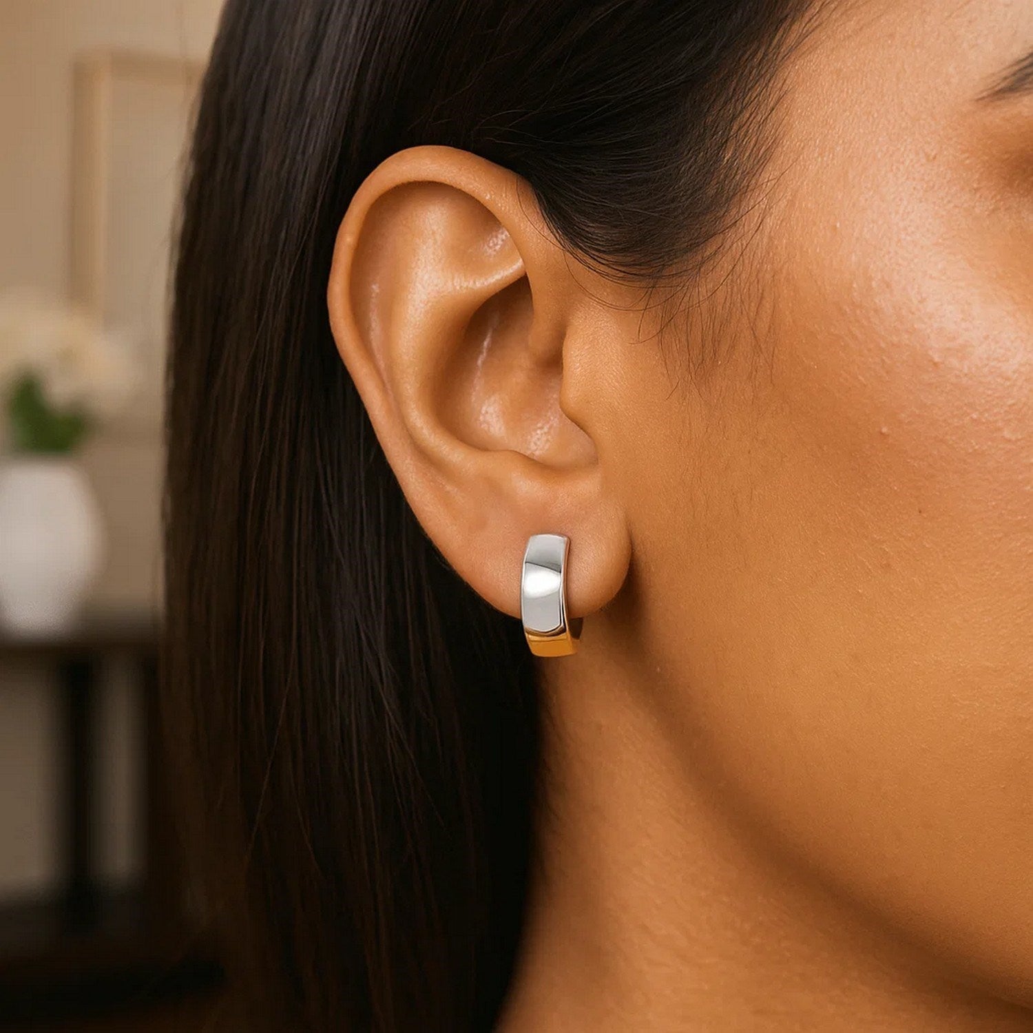 14k two-tone gold snuggable style hoop earrings with a hinged snap back.