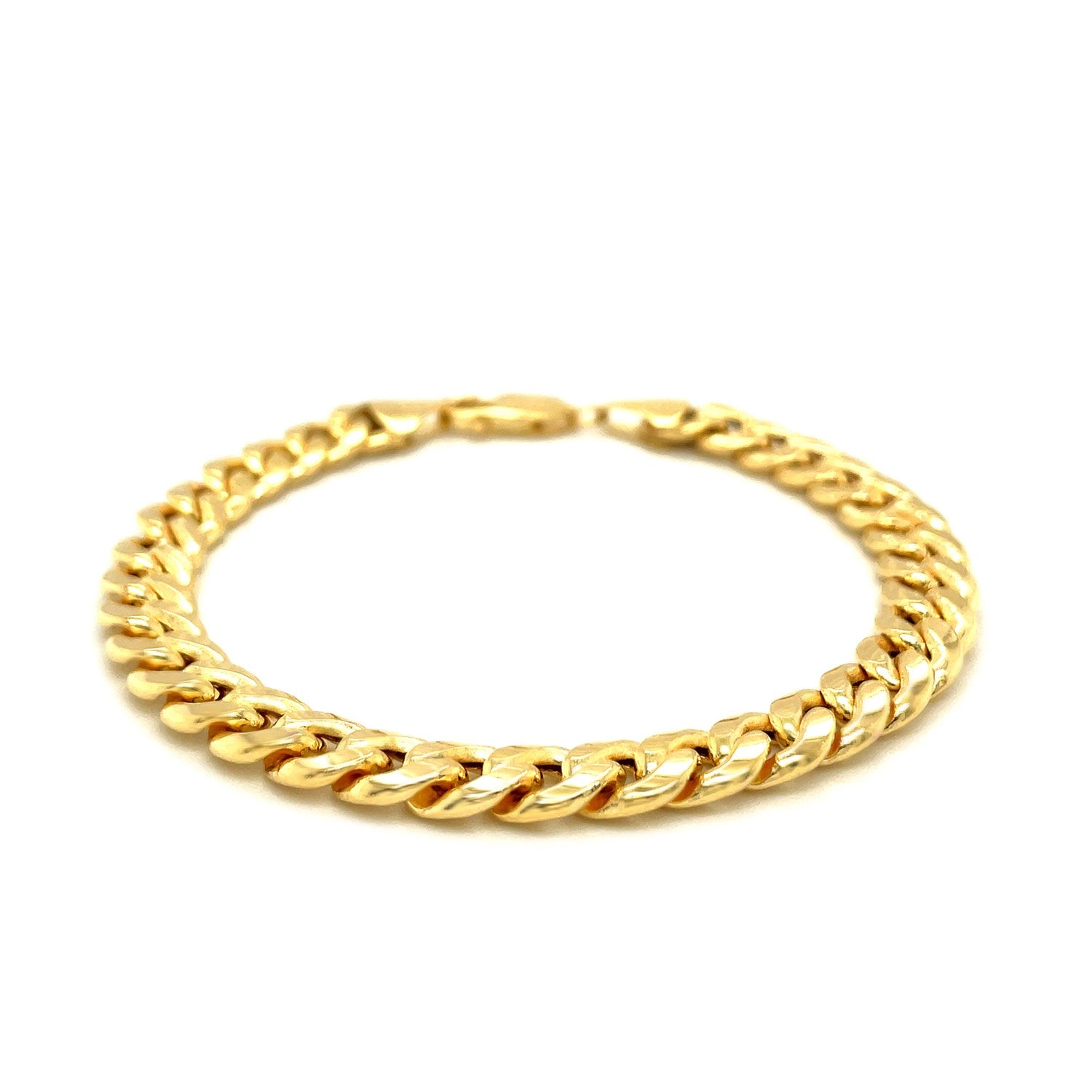 A 10k yellow gold light Miami Cuban bracelet with a lobster clasp.