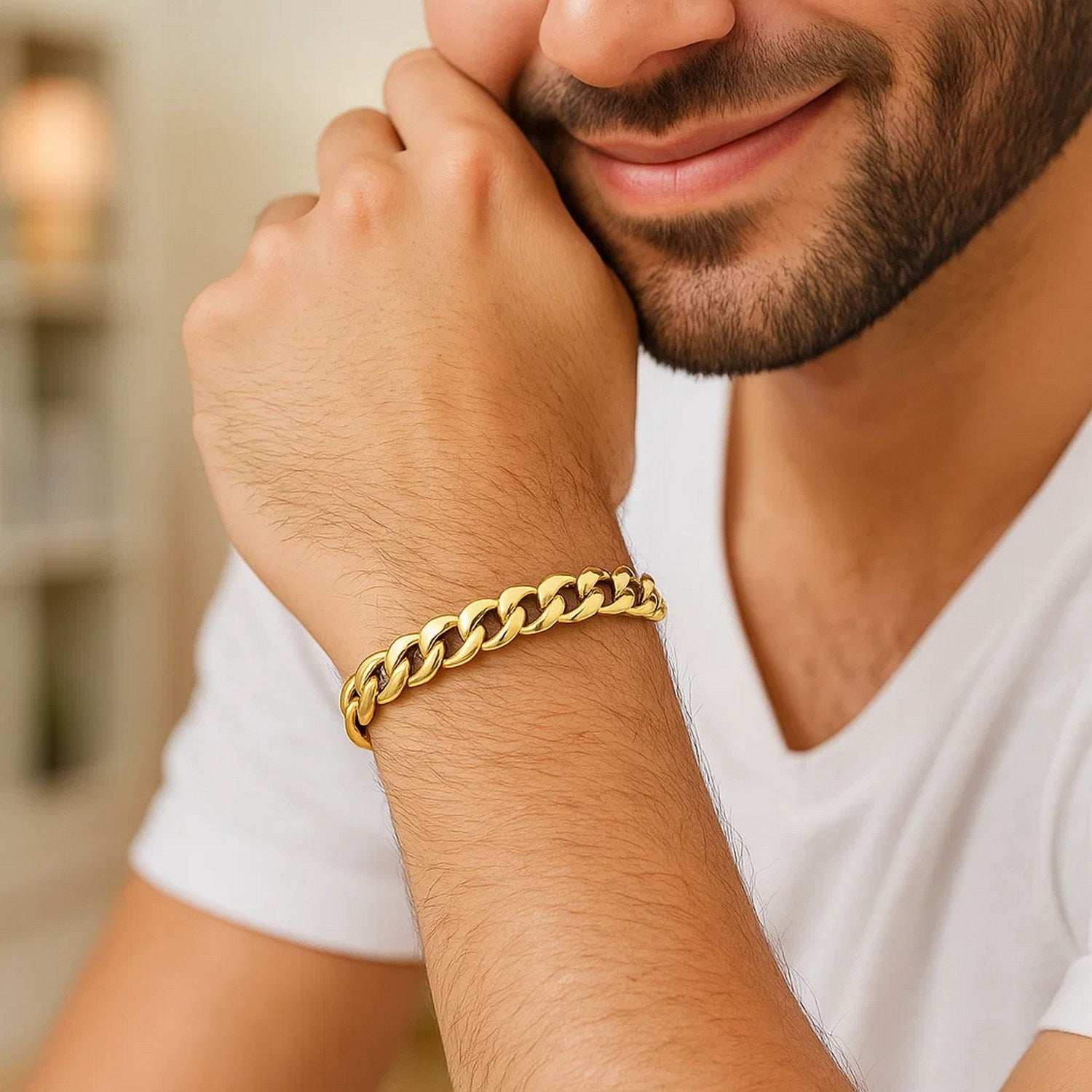 A man wears an 8mm 10k yellow gold light Miami Cuban bracelet.