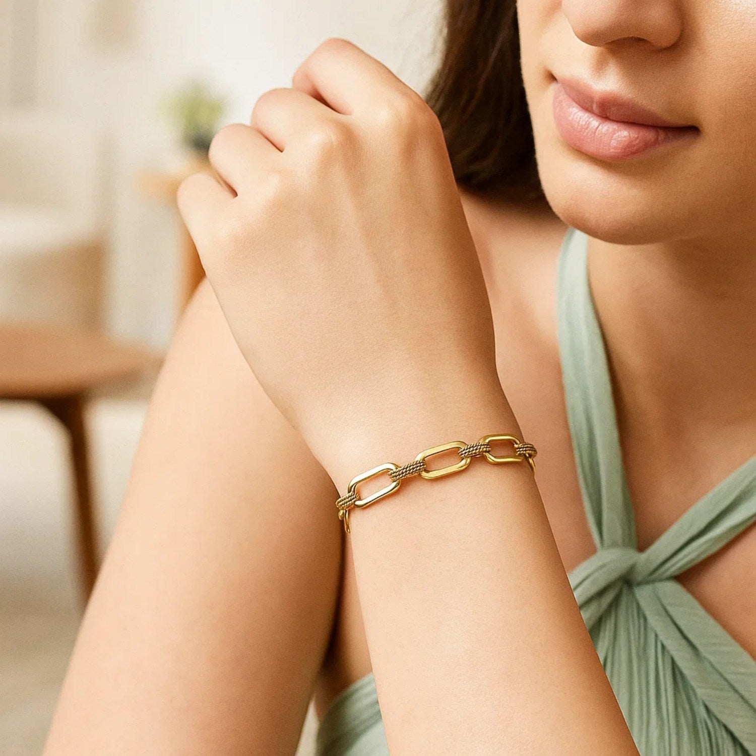 14k yellow gold paperclip chain bracelet with alternating smooth and textured links.