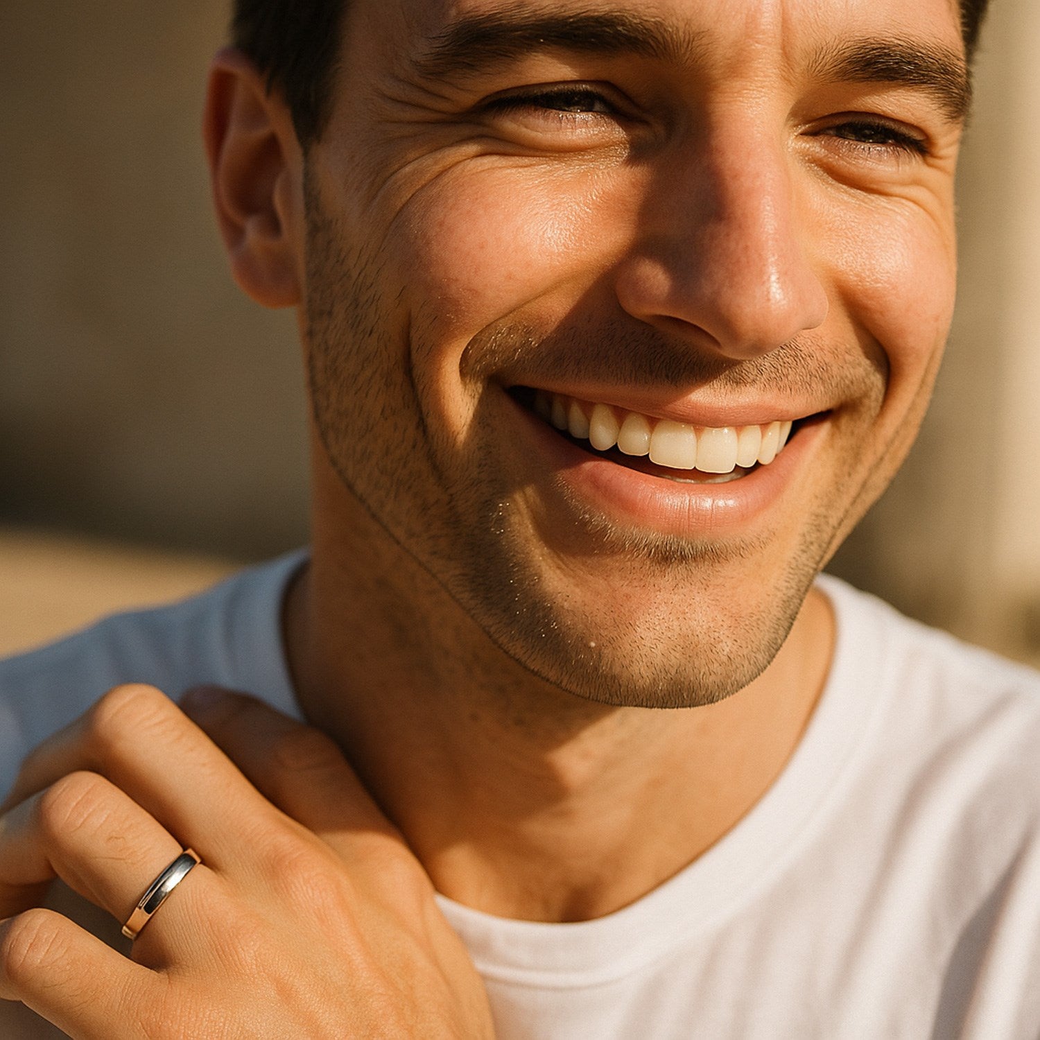 14k white gold comfort fit wedding band on a man's ring finger.