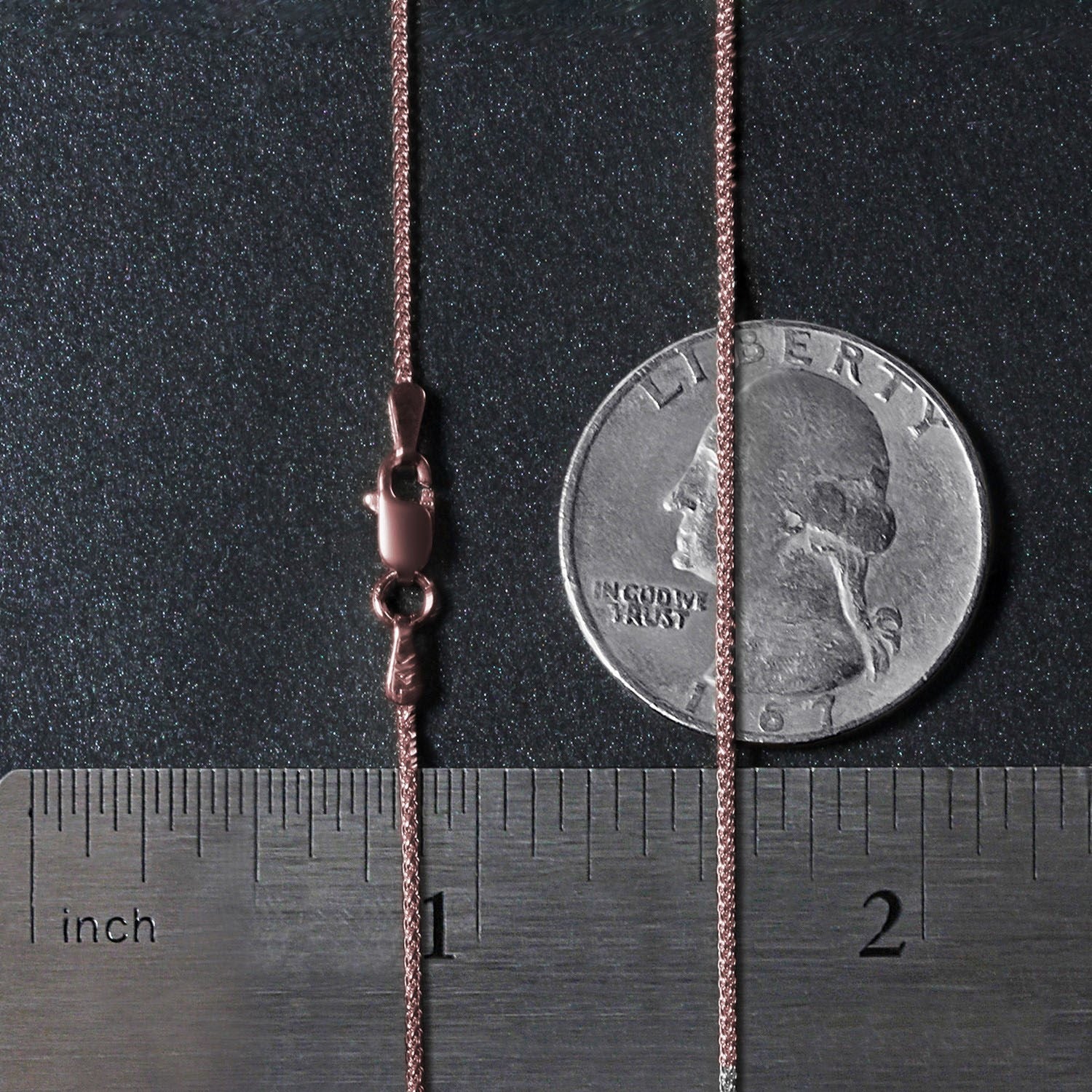 14k rose gold round wheat chain with a lobster clasp, shown with a ruler and coin.