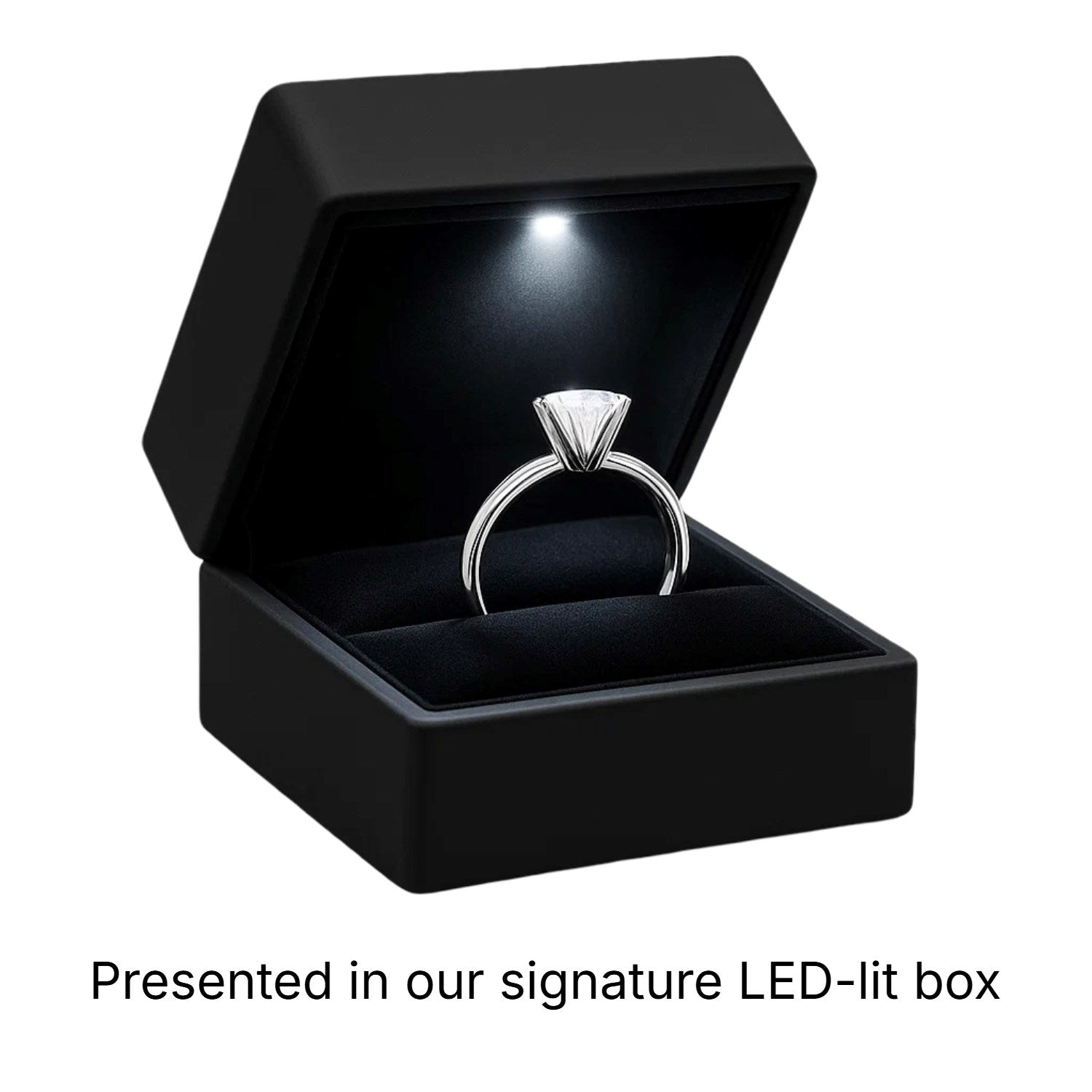 A princess-cut diamond ring in a black LED-lit presentation box.